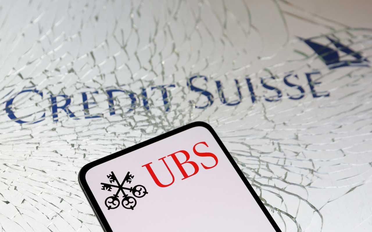 UBS Group and Credit Suisse logos are seen in this illustration taken March 18. Photo: Reuters