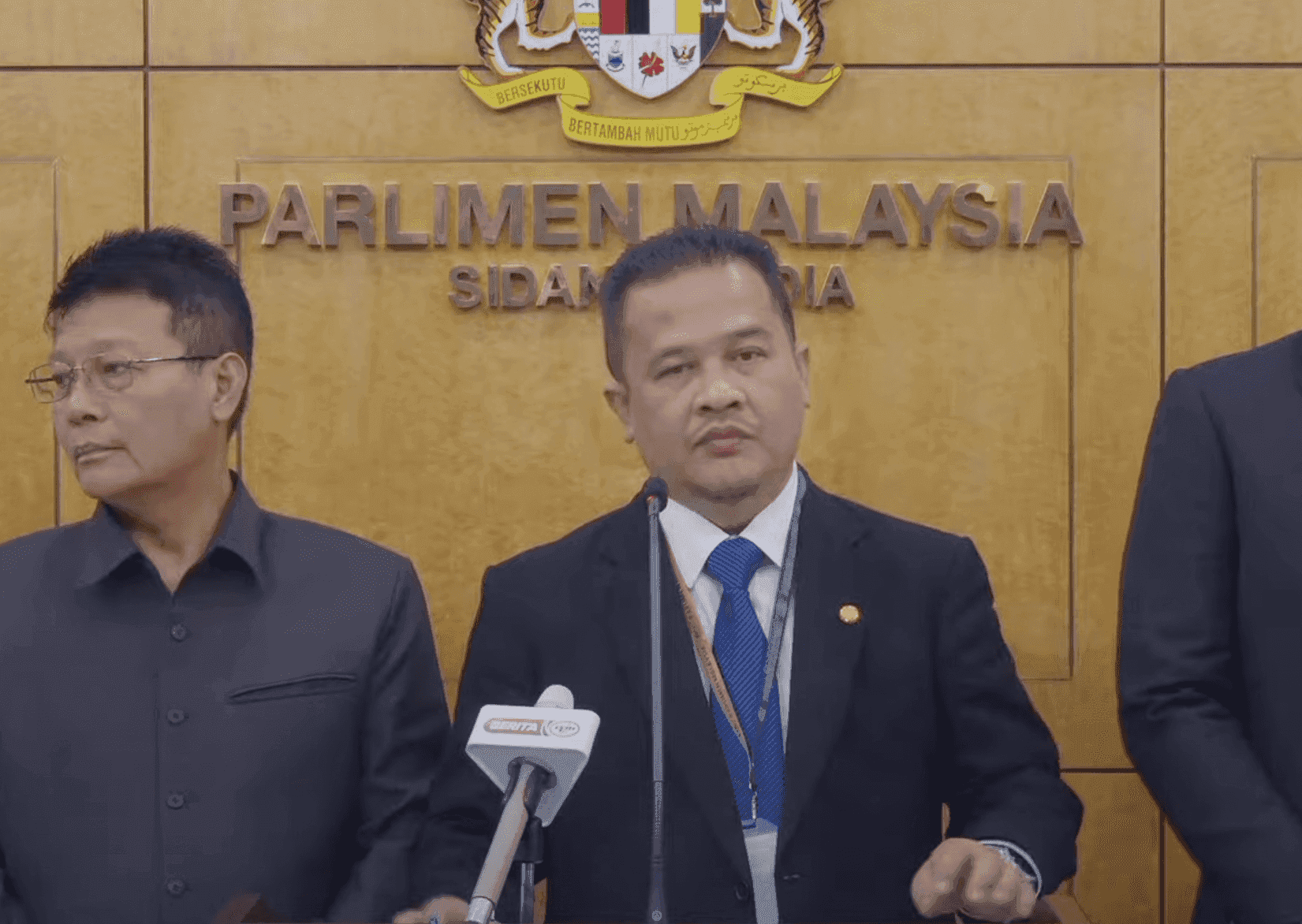 Padang Serai MP Azman Nasrudin speaks at a press conference in the Parliament building.