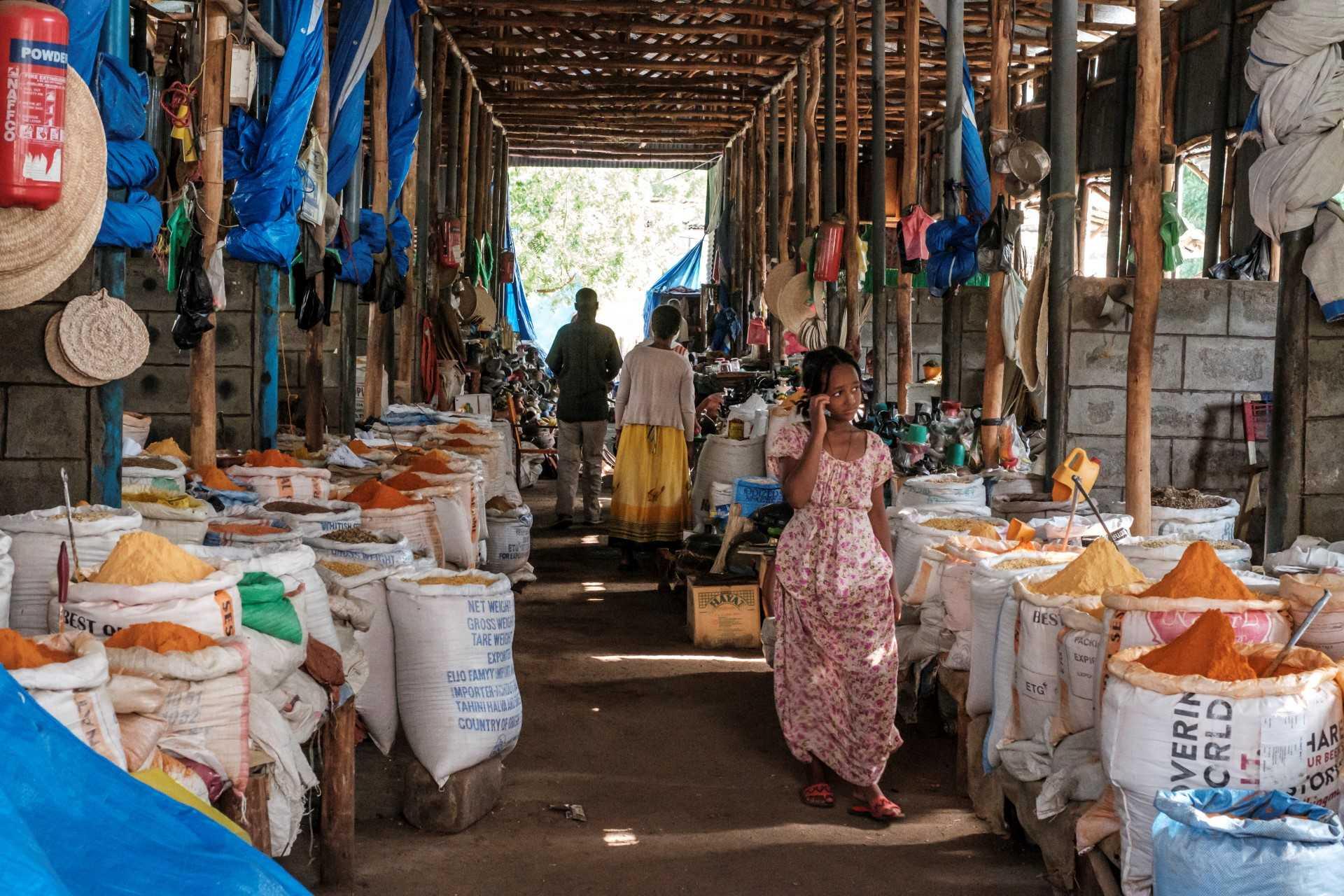 A girl walks through the market in the city of Humera, in the northern Tigray Region, the last Ethiopian city south of the border with Eritrea and Sudan on July 11, 2021. Photo: AFP
