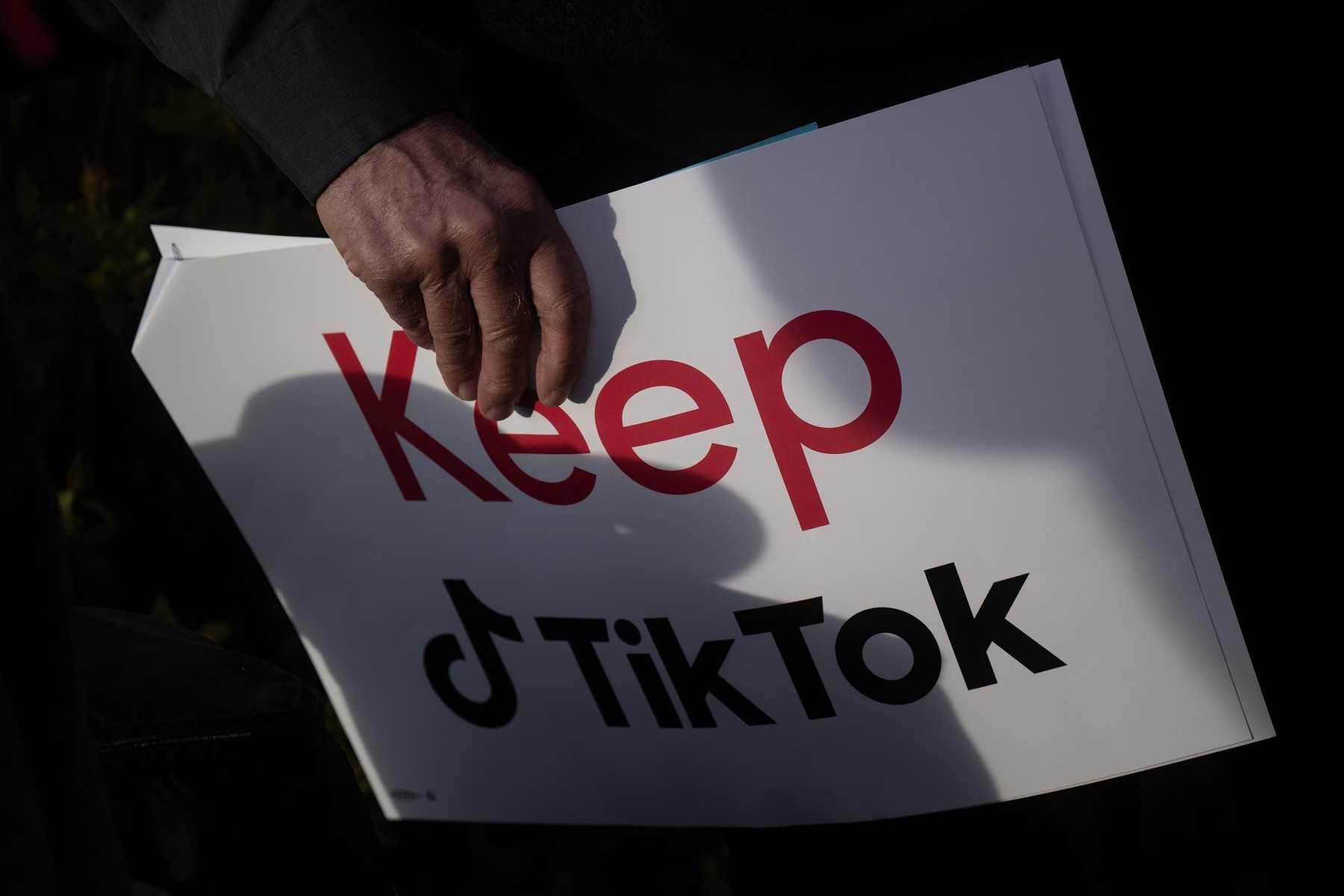 A person holds a sign during a press conference about their opposition to a TikTok ban on Capitol Hill in Washington, DC on March 22. Photo: AFP
