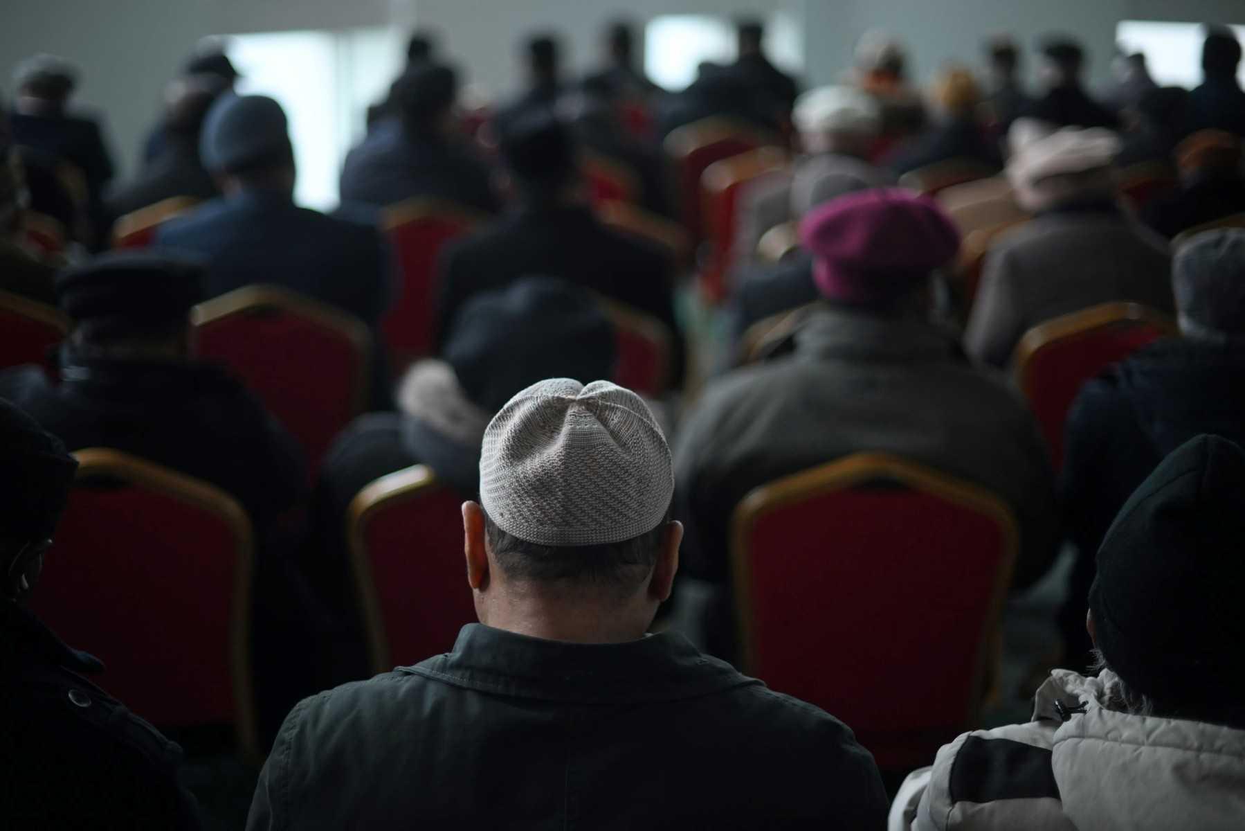 Muslims attend a service at a mosque in southwest London on March 3. Photo: AFP