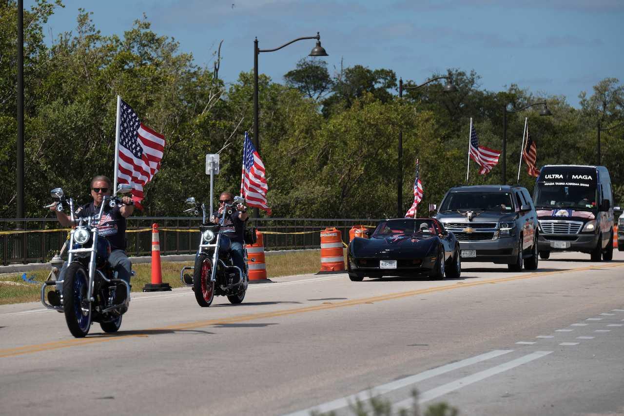Supporters of former US president Donald Trump ride their motorcycles outside his Mar-a-Lago resort days after he posted a message saying that he expects to be arrested and called on his supporters to protest, in Palm Beach, Florida, March 23. Photo: Reuters