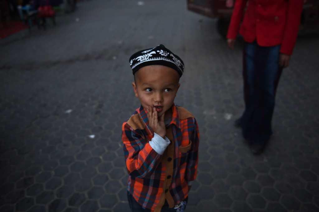 This photo taken on April 15, 2015 shows a Uighurs boy in a night market in Hotan, in China's western Xinjiang region. Photo: AFP 