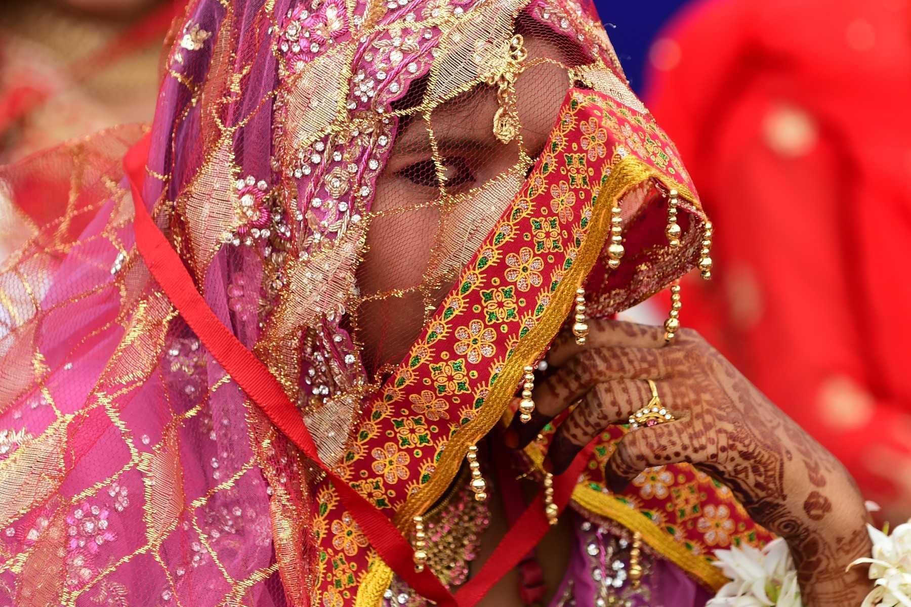 A bride attends a mass marriage ceremony organised by a welfare trust on the outskirts of Ahmedabad in India. Photo: AFP
