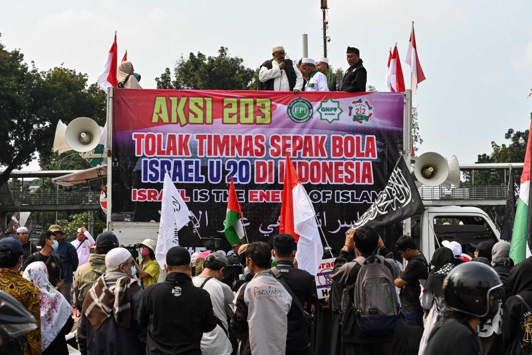 Indonesians take part in a rally in Jakarta on March 20, to demand their government to reject the participation of Israel's team in the upcoming 2023 Fifa U-20 World Cup. Photo: AFP