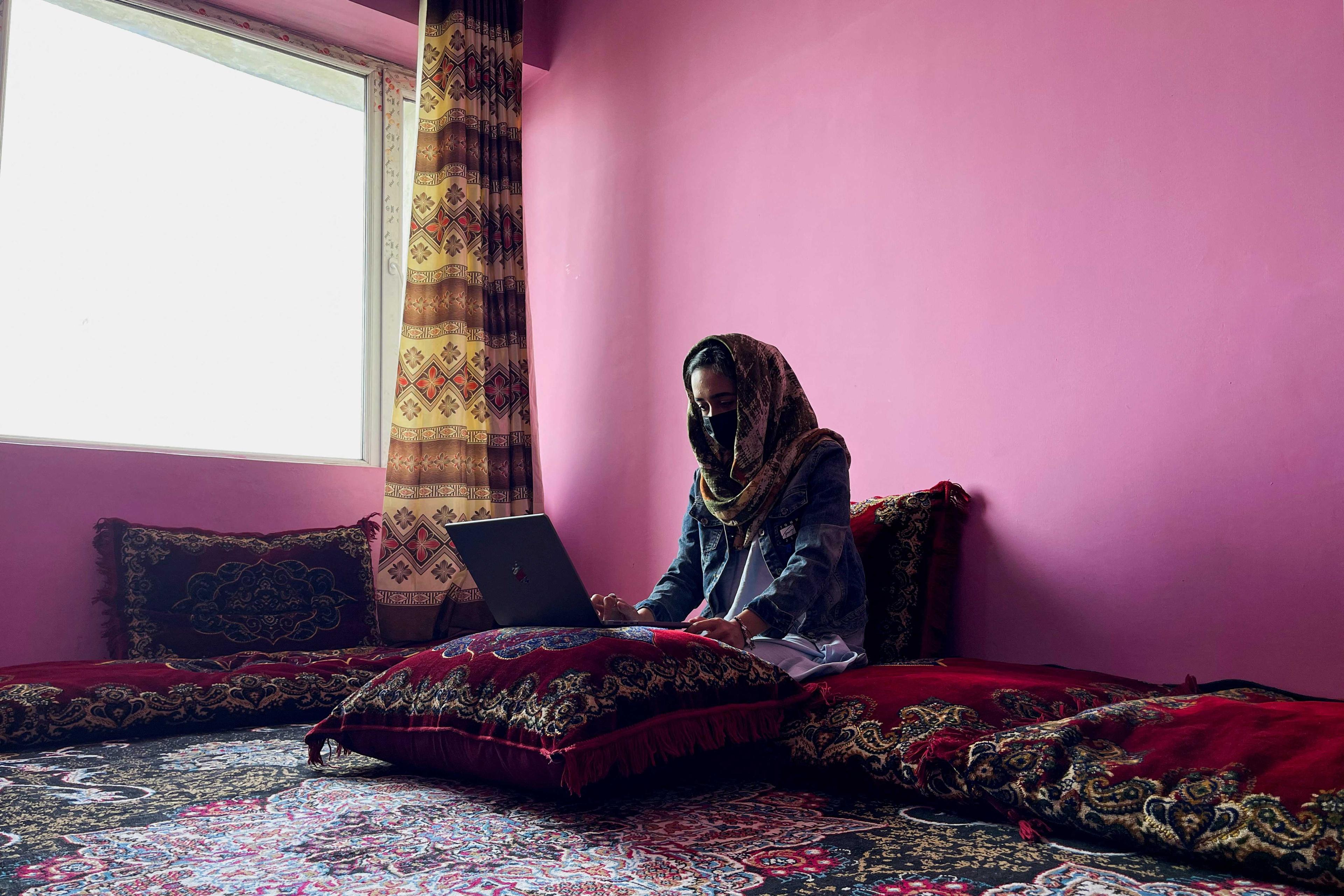 Sofia, an Afghan student, speaks English during an online class, at her house in Kabul, Afghanistan, March 18. Photo: Reuters