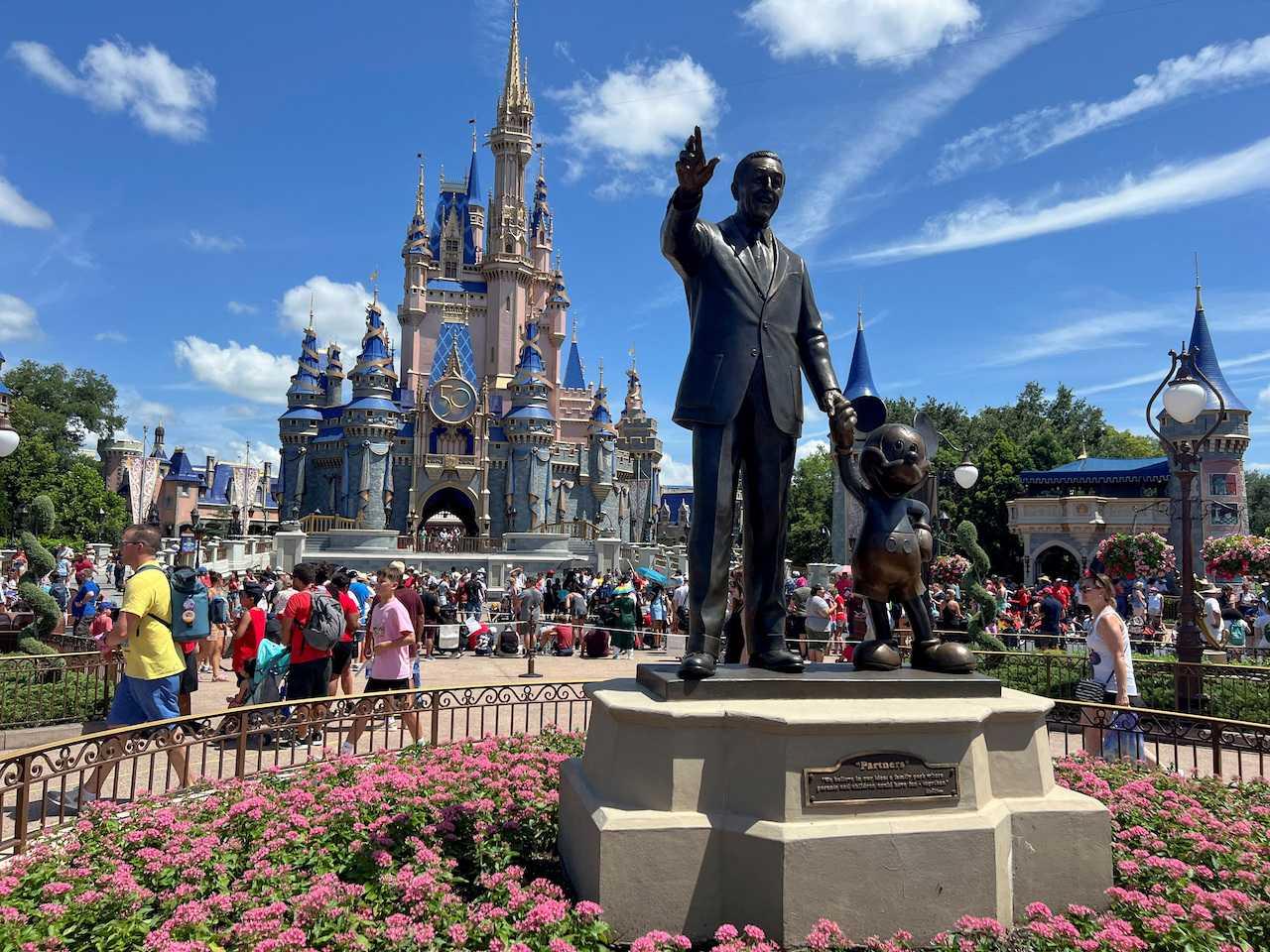 People gather at the Magic Kingdom theme park before the 'Festival of Fantasy' parade at Walt Disney World in Orlando, Florida, July 30, 2022. Photo: Reuters