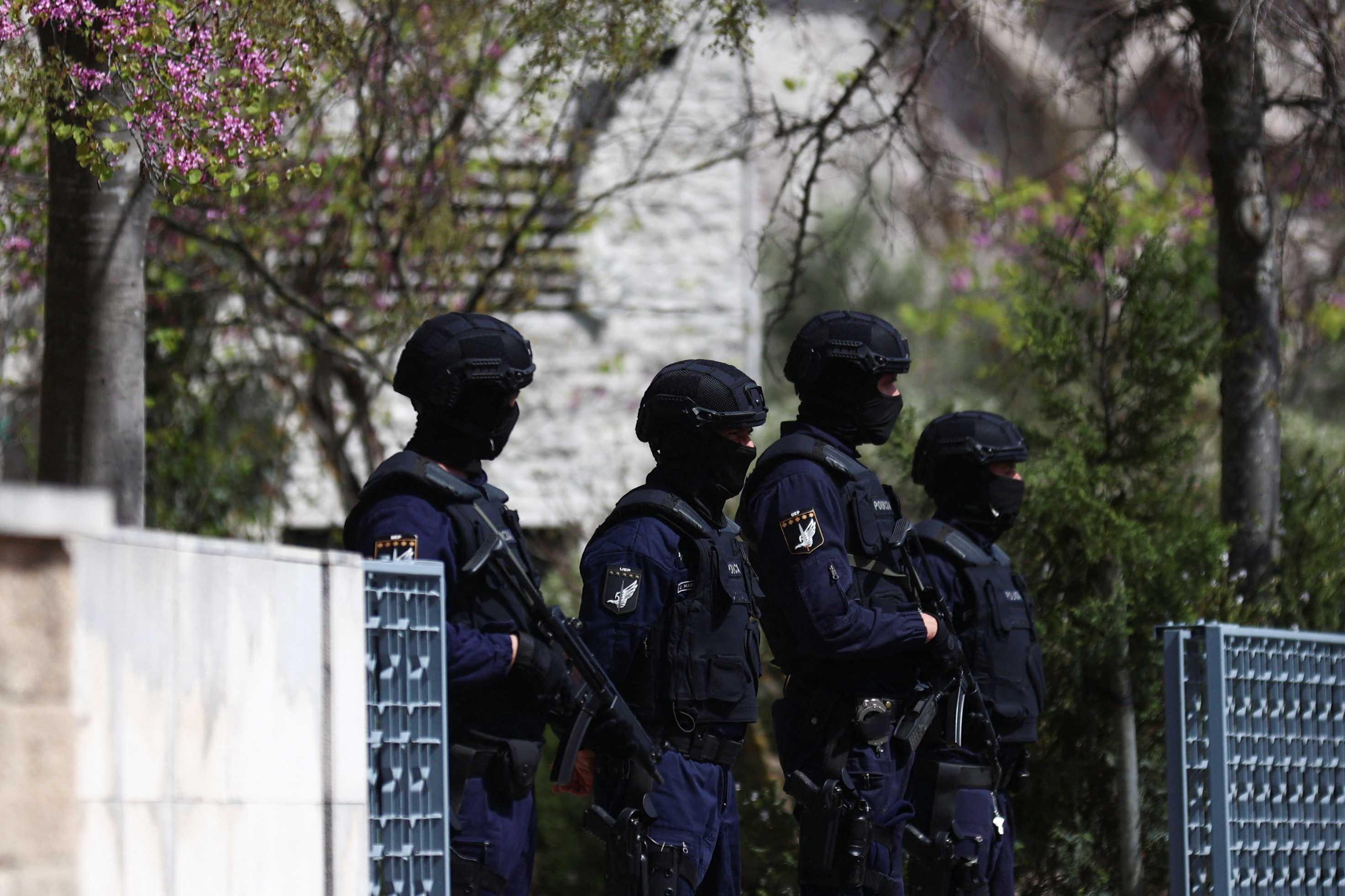 Police officers stand guard outside Ismaili Centre, after a deadly knife attack in Lisbon, Portugal, March 28. Photo: Reuters