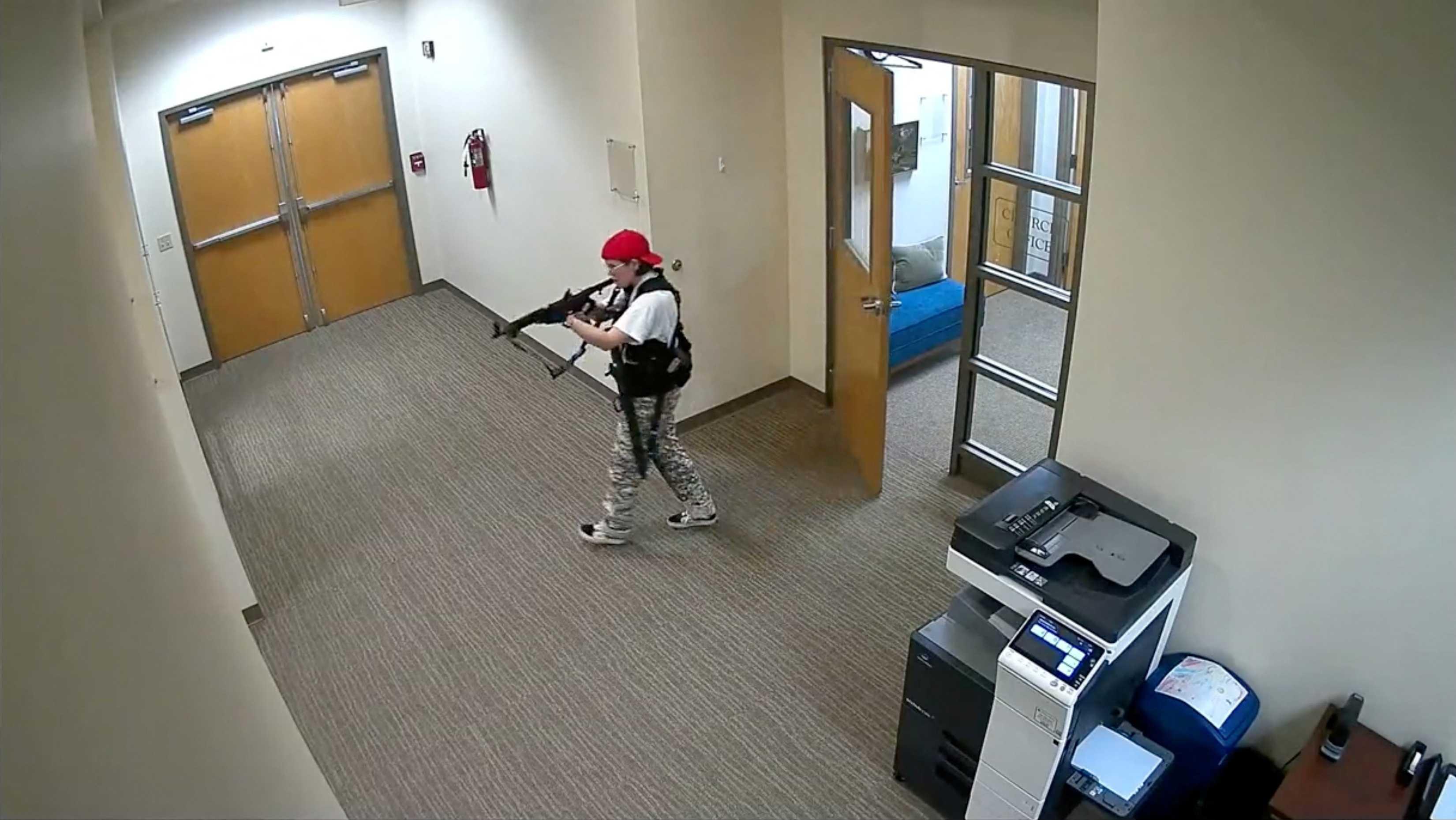 A still image from surveillance video shows what the Metropolitan Nashville Police Department describe as mass shooting suspect Audrey Elizabeth Hale, walking in The Covenant School carrying weapons in Nashville, Tennessee, US March 27. Photo: Reuters