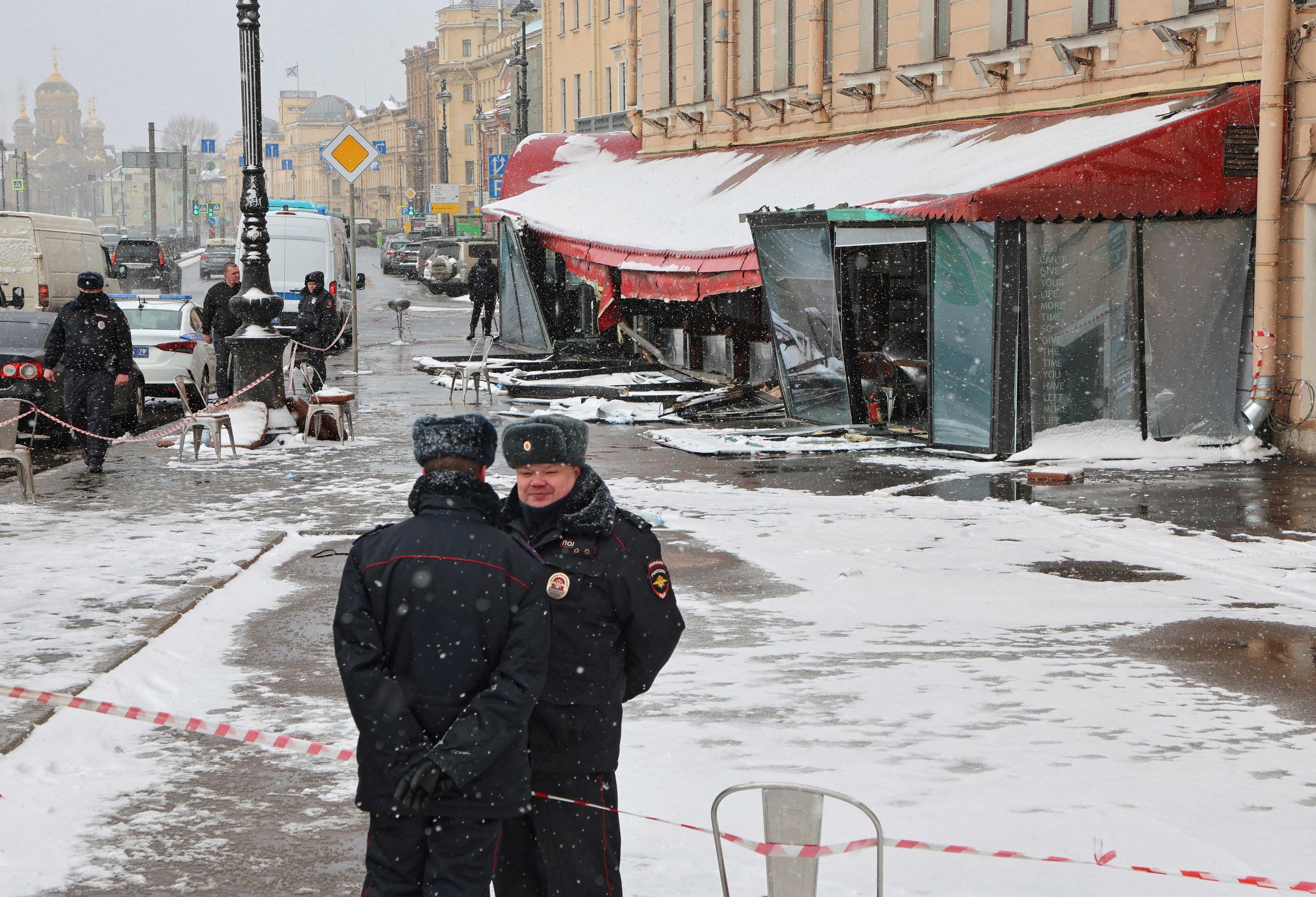 Police officers stand guard at the scene of the cafe explosion in which Russian military blogger Vladlen Tatarsky, (real name Maxim Fomin) was killed the day before in Saint Petersburg, Russia April 3. Photo: Reuters