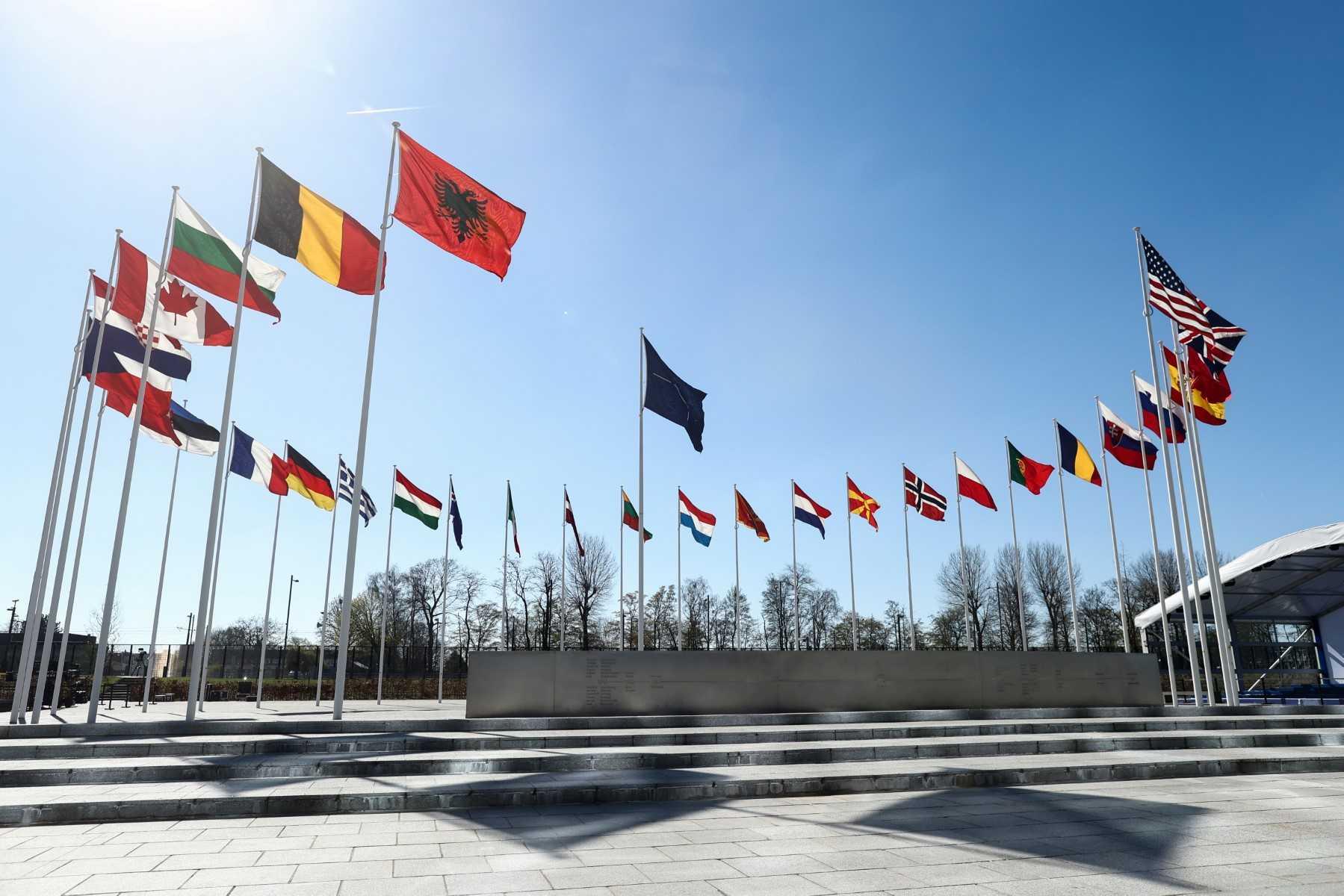 The national flags of countries member of the Nato fly outside the organisation headquarters in Brussels on April 3. Photo: AFP