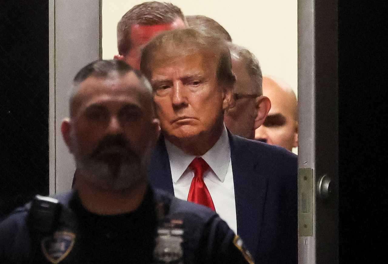 Former US president Donald Trump arrives at the Manhattan Criminal Courthouse, after his indictment by a Manhattan grand jury following a probe into hush money paid to porn star Stormy Daniels, in New York City, April 4. Photo: Reuters