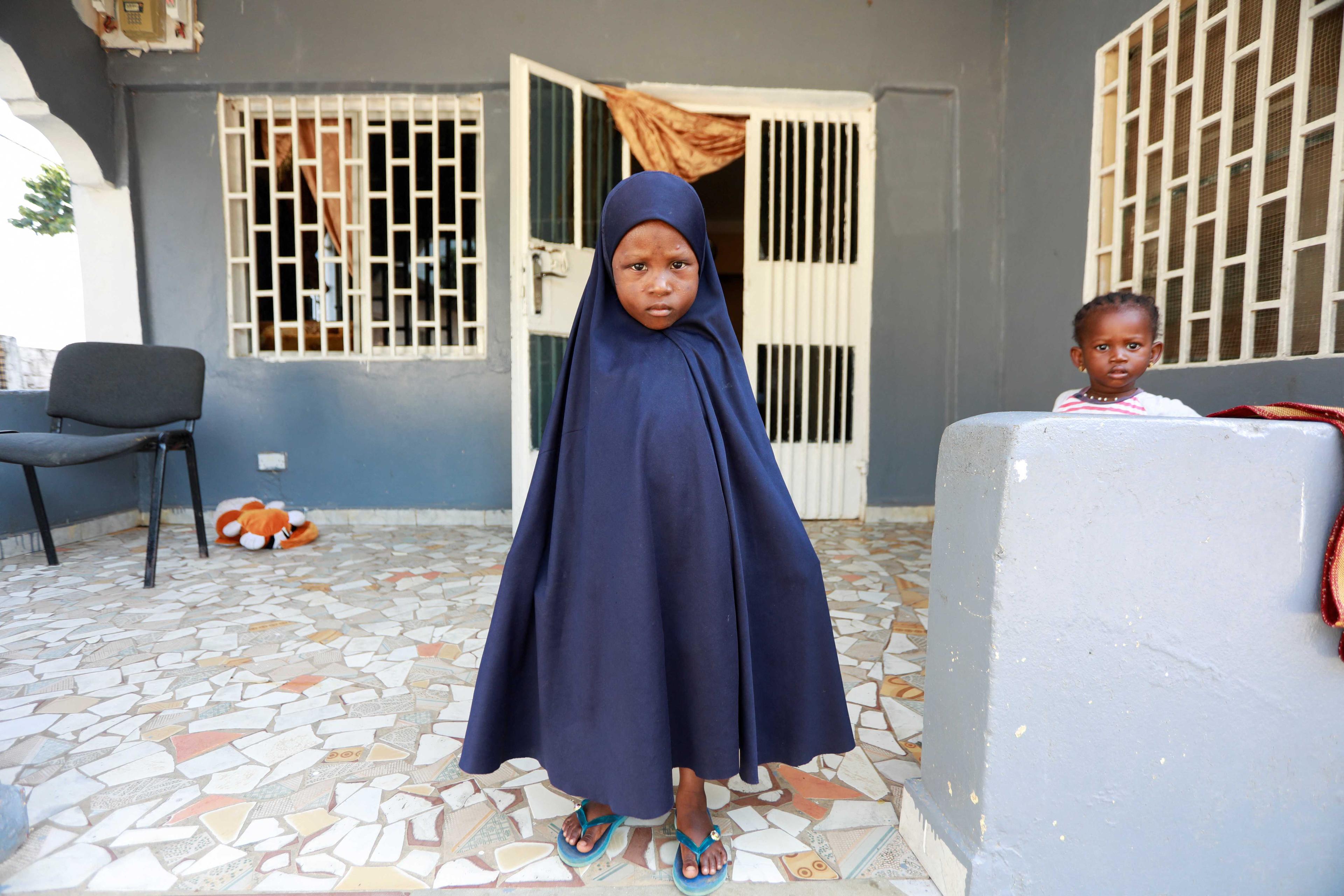 A child poses for a photo at her home in Tanji, Gambia Nov 1, 2022. Photo: Reuters