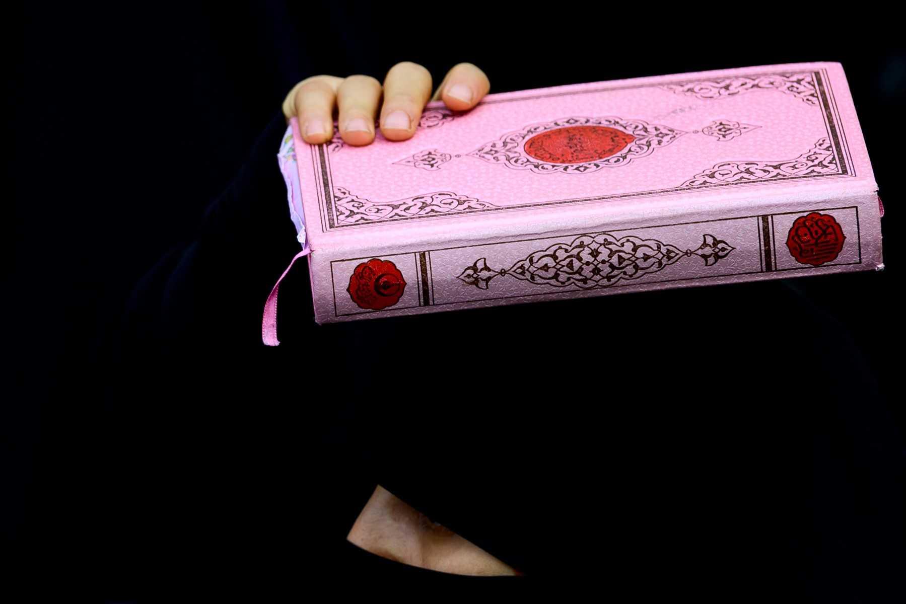 A protester holds a copy of the Quran in front of the consulate-general of Sweden in Istanbul on Jan 22, after Rasmus Paludan, leader of Danish far-right political party Hard Line burned a copy of the Quran near the Turkish embassy in Stockholm. Photo: AFP