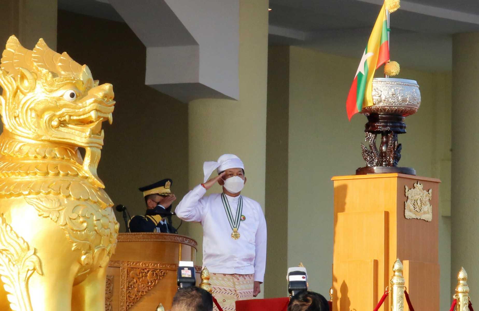 Myanmar's junta chief senior general Minn Aung Hlaing salutes during a ceremony to mark the 75th anniversary of the country's Union Day in Naypyidaw on Feb 12, 2022. Photo: AFP