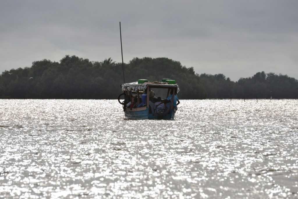 People ride a fishing boat off the coast of the Ivorian town of Grand Lahou, situated where the Bandama River meets the Gulf of Guinea. The Gulf of Guinea has become a global piracy hotspot in recent years although cases have fallen there since 2021. Photo: AFP