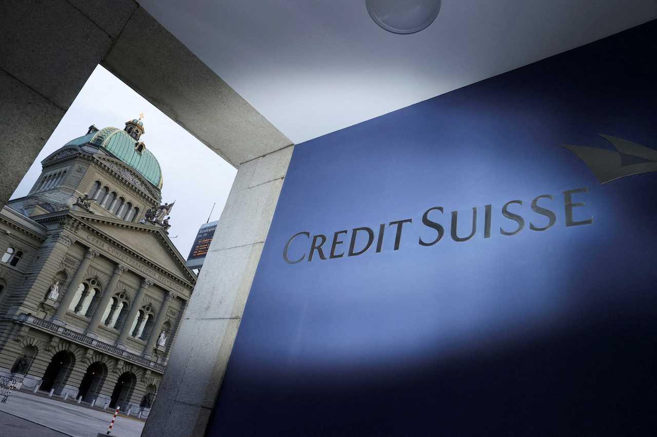 The logo of Credit Suisse is pictured in front of the Swiss parliament building, in Bern, Switzerland, March 19. Photo: Reuters