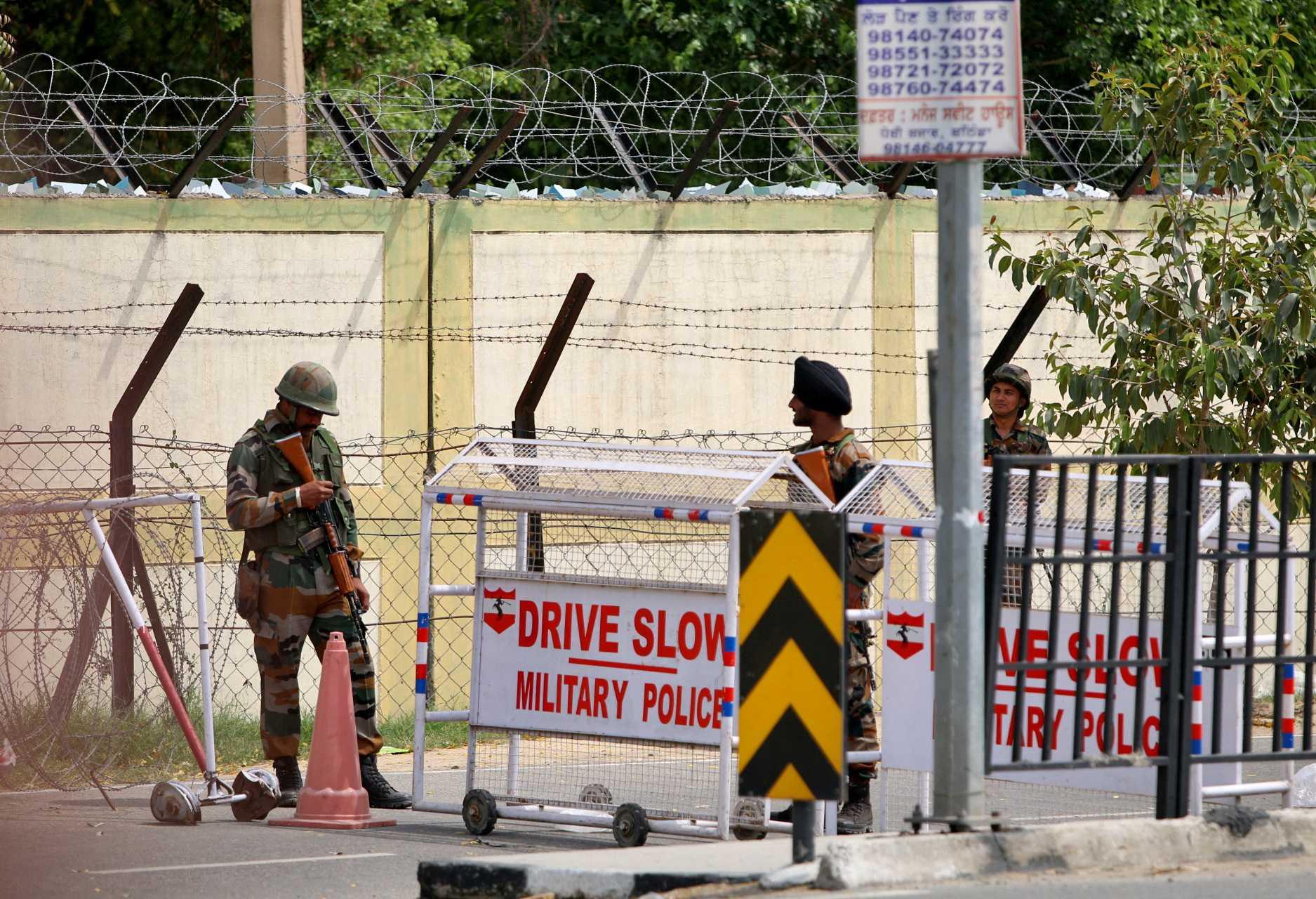 Indian army soldiers stand next to a barricade outside a military base, after a firing incident in Bathinda, India, April 12. Photo: Reuters