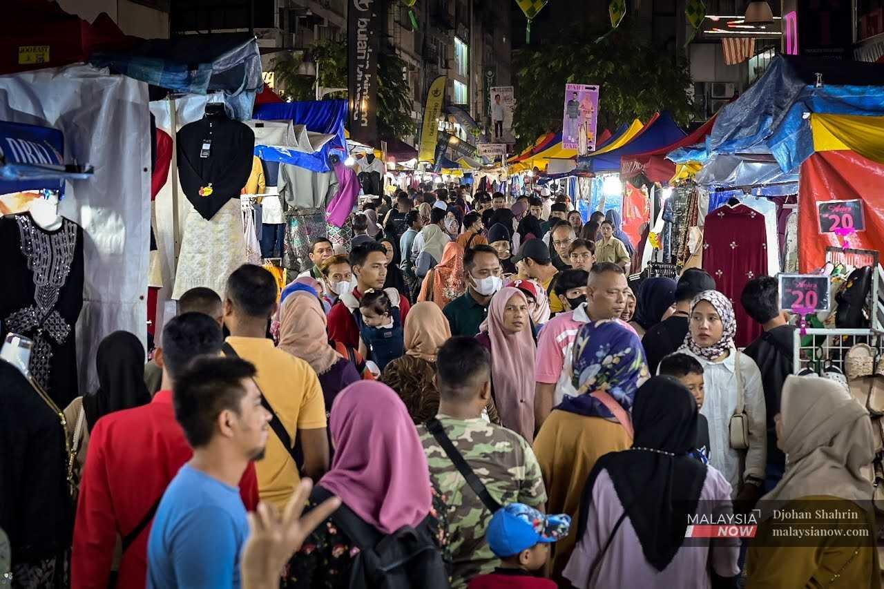 Crowds mingle at the Aidilfitri bazaar in Jalan Tuanku Abdul Rahman, Kuala Lumpur. 