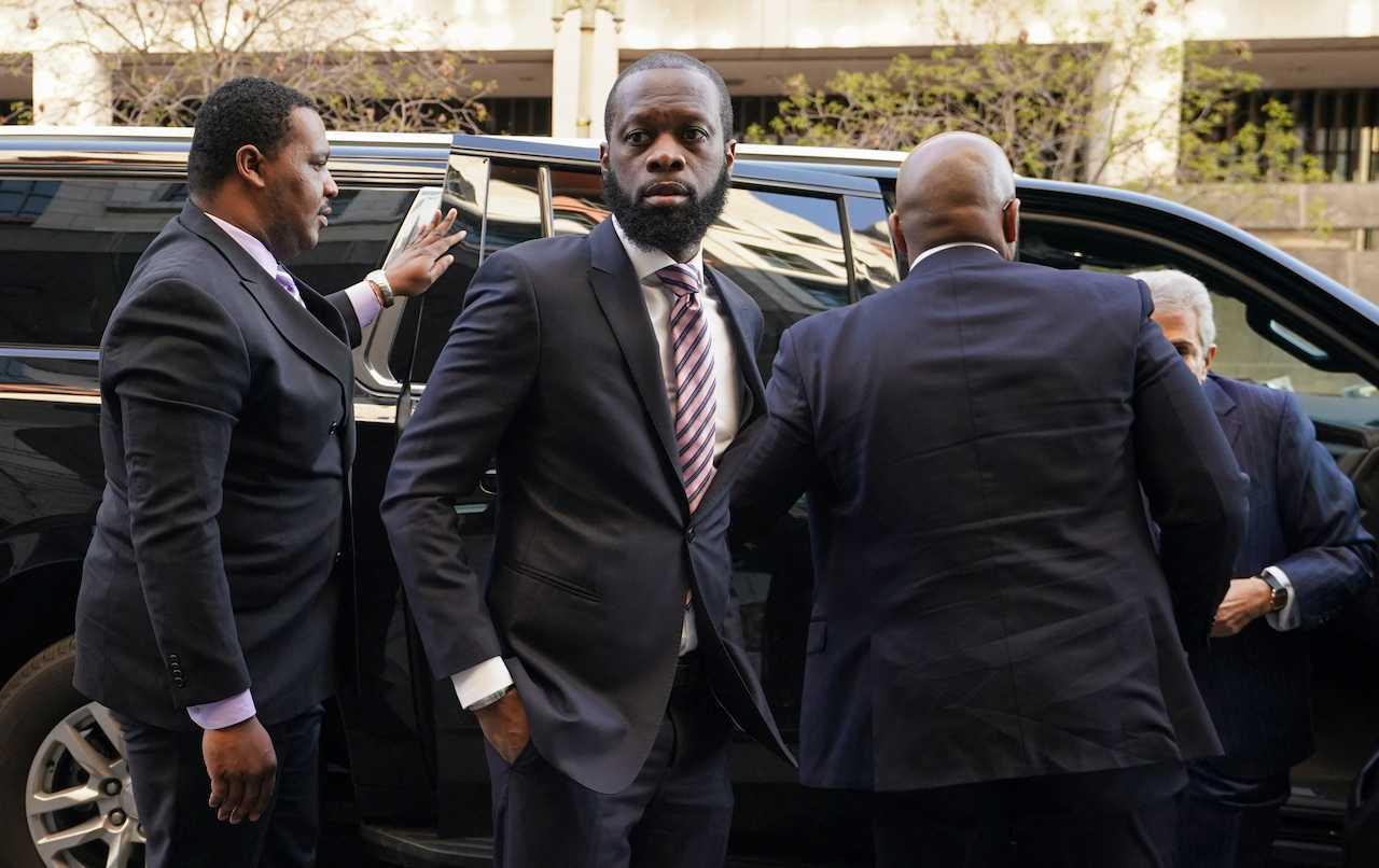 Grammy award-winning Fugees rapper Prakazrel 'Pras' Michel, who is facing criminal charges in an alleged illegal lobbying campaign, arrives for opening arguments in his trial at the US District Court in Washington, March 30. Photo: Reuters
