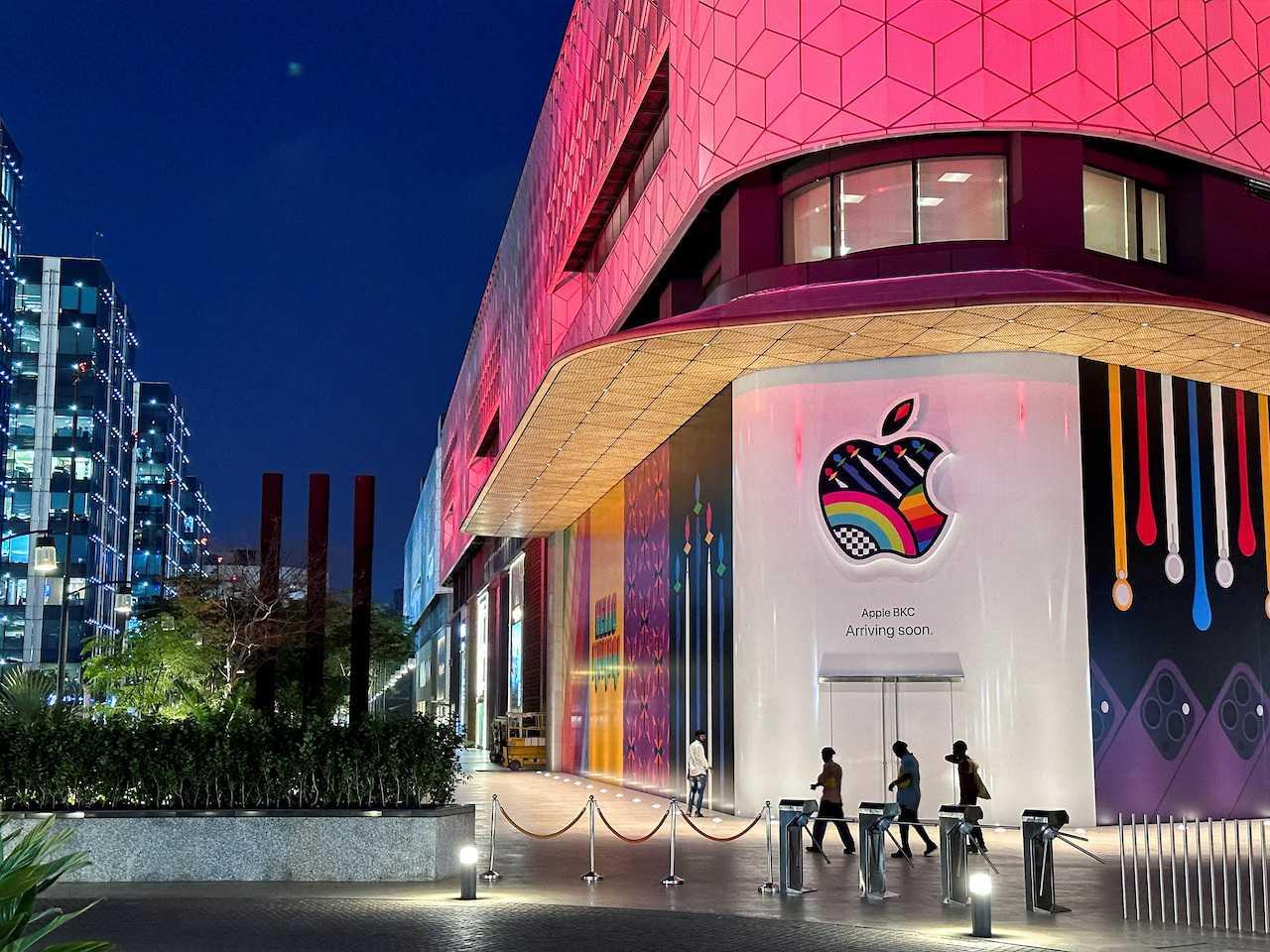 People walk past the barricade of India's first Apple retail store, ahead of its launch at Jio World Drive Mall, Mumbai, India, April 5. Photo: Reuters