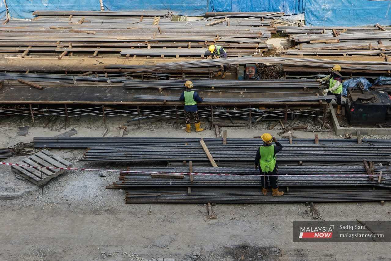 Foreign workers at a construction site in Putrajaya. 
