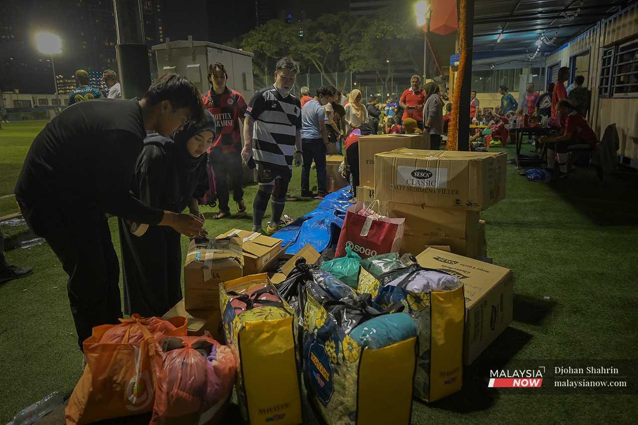 The volunteers include university students who collect the donations and help distribute them to those in need. 