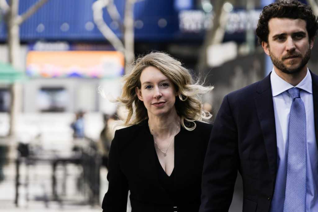 In this file photo taken on March 17, former Theranos CEO Elizabeth Holmes alongside her boyfriend Billy Evans, walks back to her hotel following a hearing at the Robert E Peckham US Courthouse in San Jose, California. Photo: AFP 