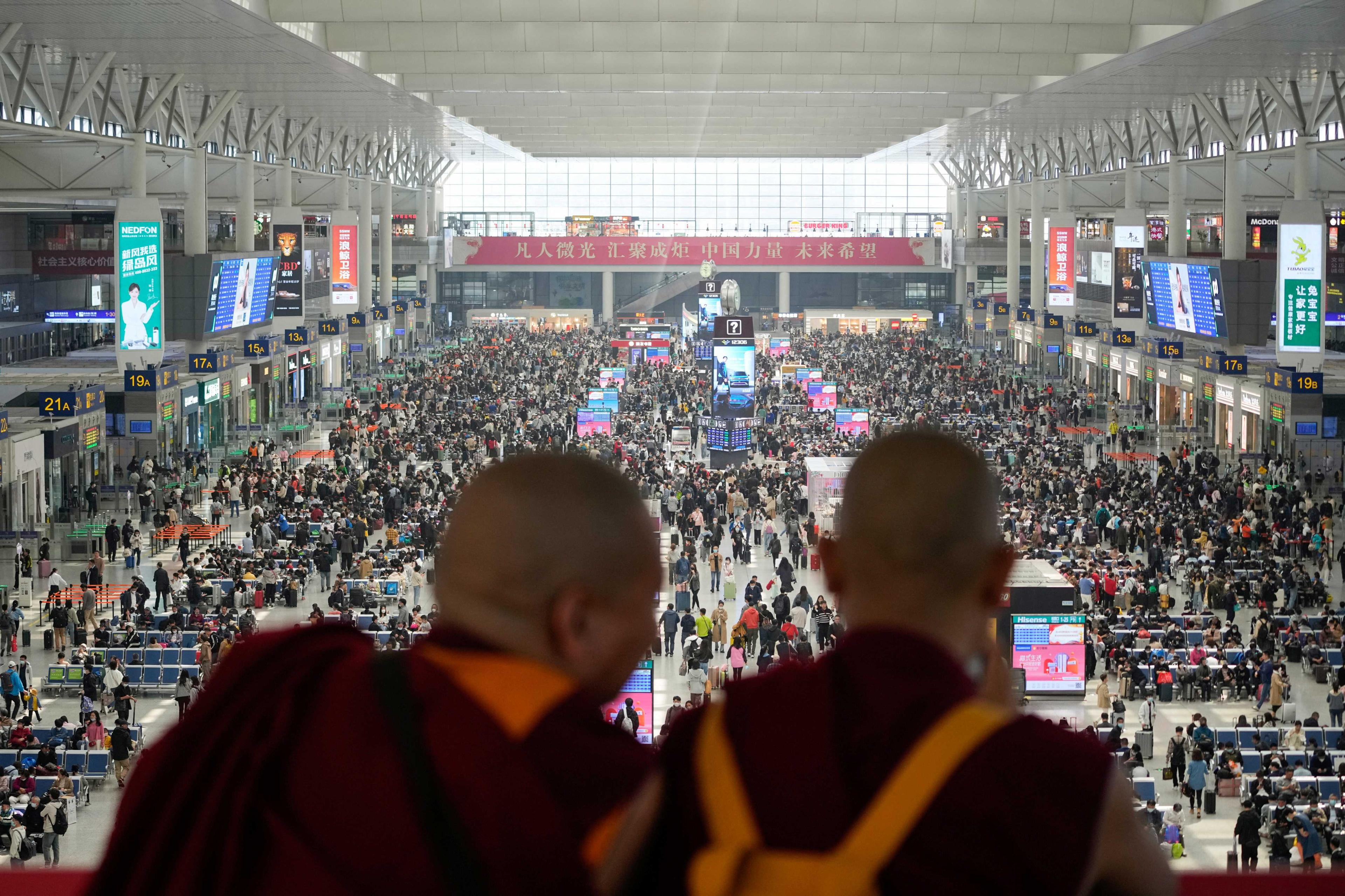 Monks take pictures at Shanghai Hongqiao railway station ahead of the five-day Labour Day holiday, in Shanghai, China, April 28. Photo: Reuters