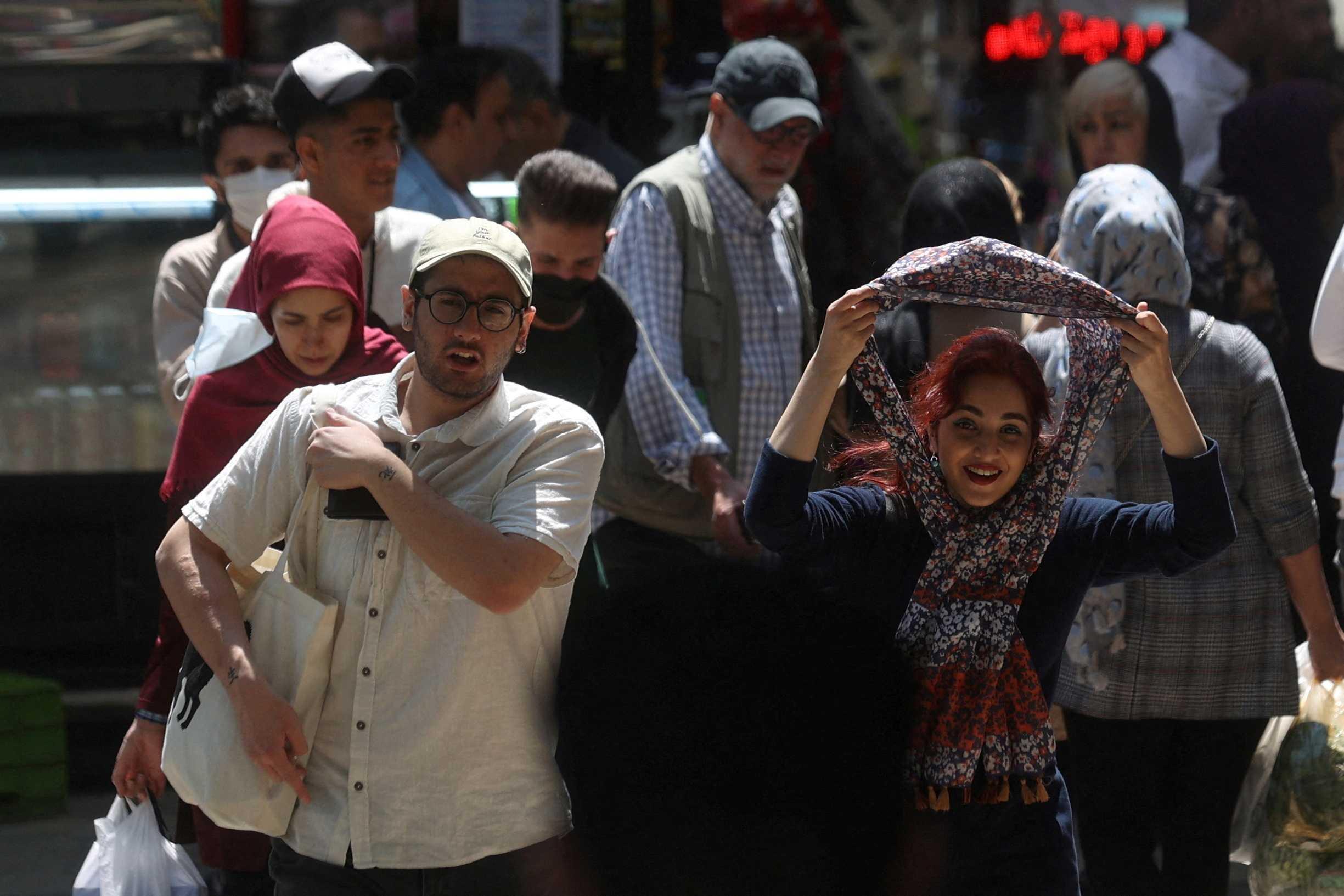 An Iranian woman walks on a street amid the implementation of the new hijab surveillance in Tehran, Iran, April 15. Photo: Reuters