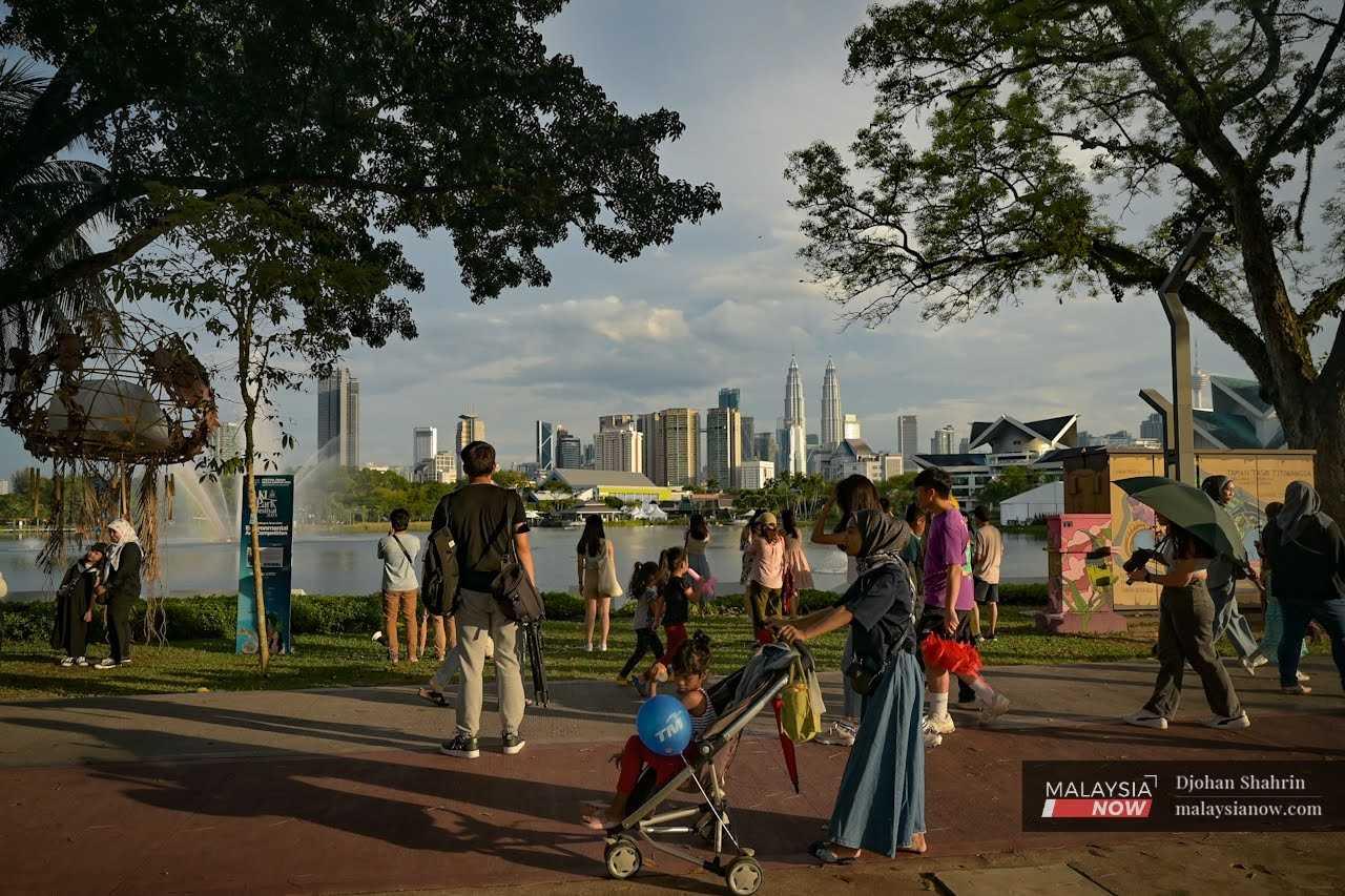 Families stroll about at Tasik Titiwangsa in Kuala Lumpur.