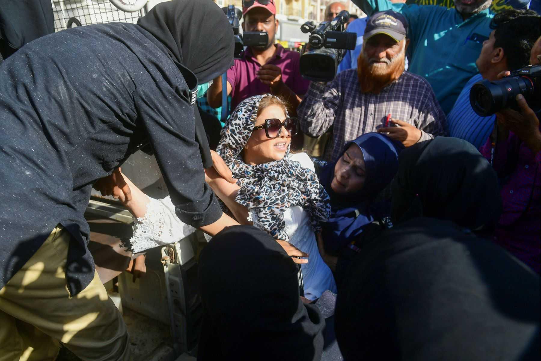 Police detain Pakistan Tehreek-e-Insaf (PTI) party activists and supporters of Pakistan's former prime minister Imran Khan, while they protest against his arrest in Karachi on May 11. Photo: AFP