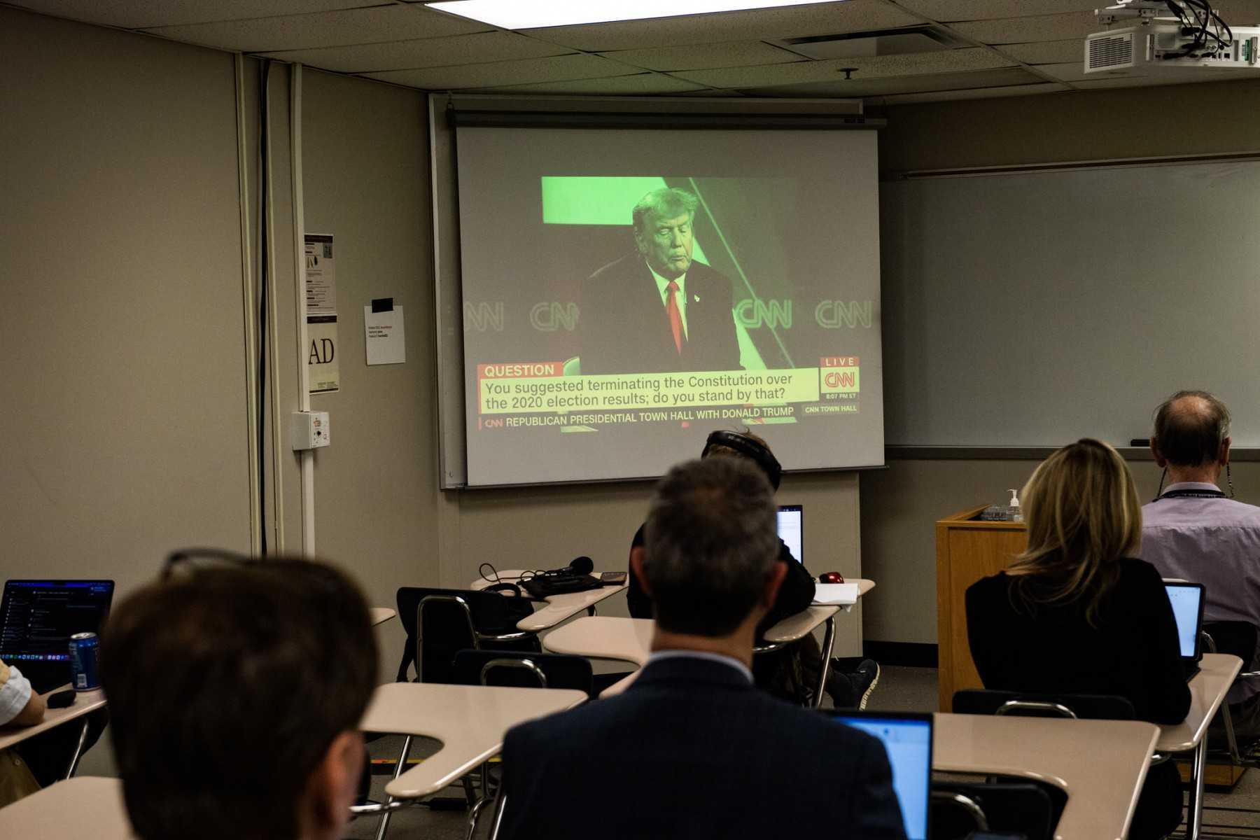 Reporters watch a CNN town hall with former US president and 2024 presidential hopeful Donald Trump at St Anselm College in Manchester, New Hampshire, on May 10. Photo: AFP