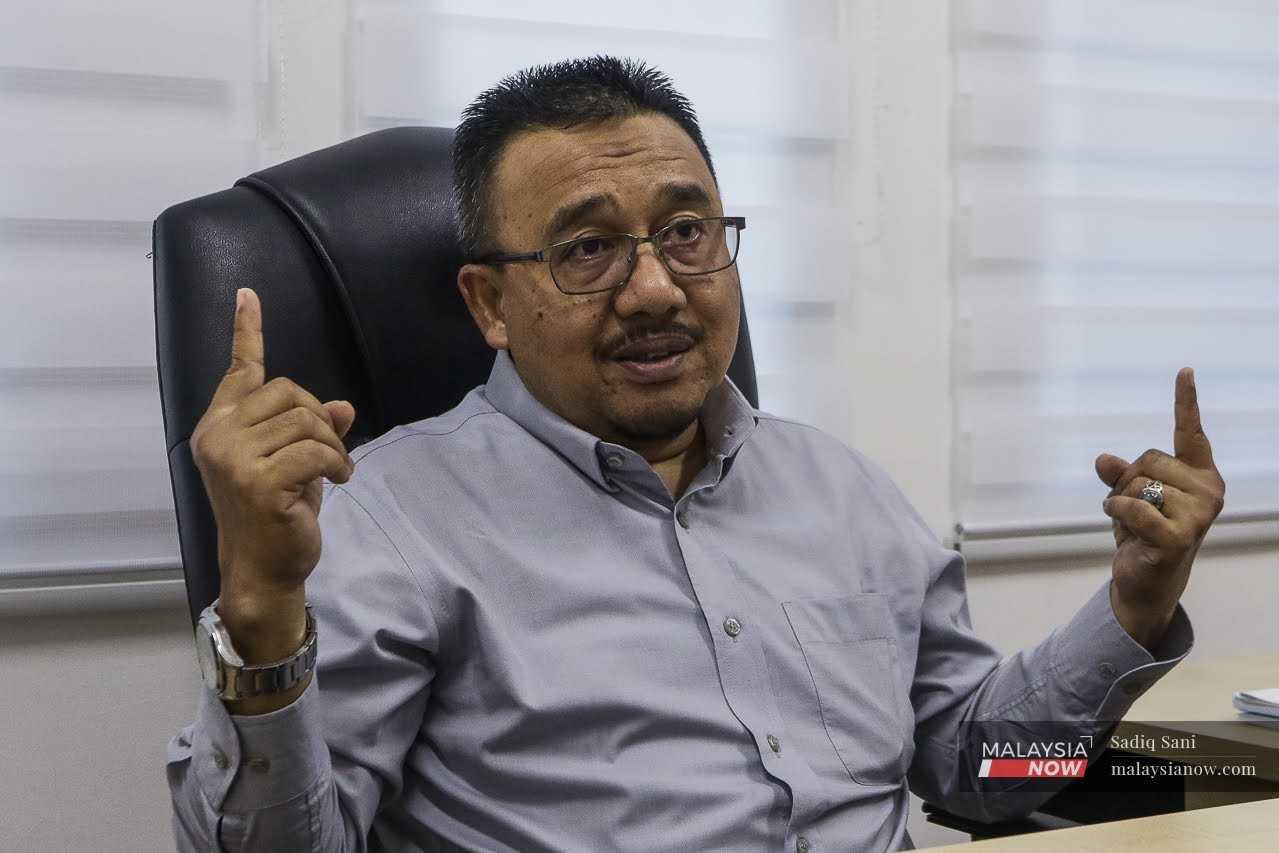 Hulu Selangor MP Hasnizan Harun gestures during an interview with MalaysiaNow.