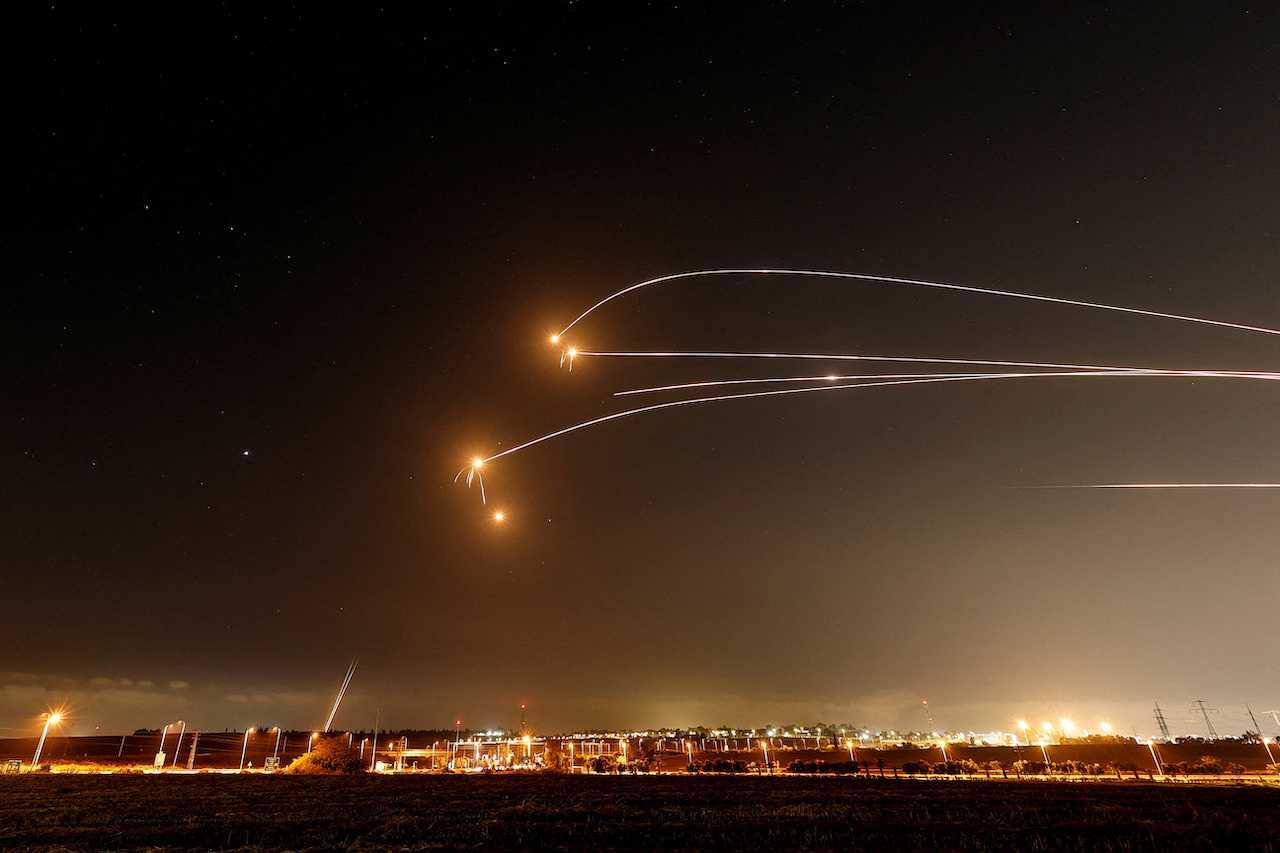 Israel's Iron Dome anti-missile system intercepts rockets launched from the Gaza Strip, as seen from Sderot, Israel, May 13. Photo: Reuters