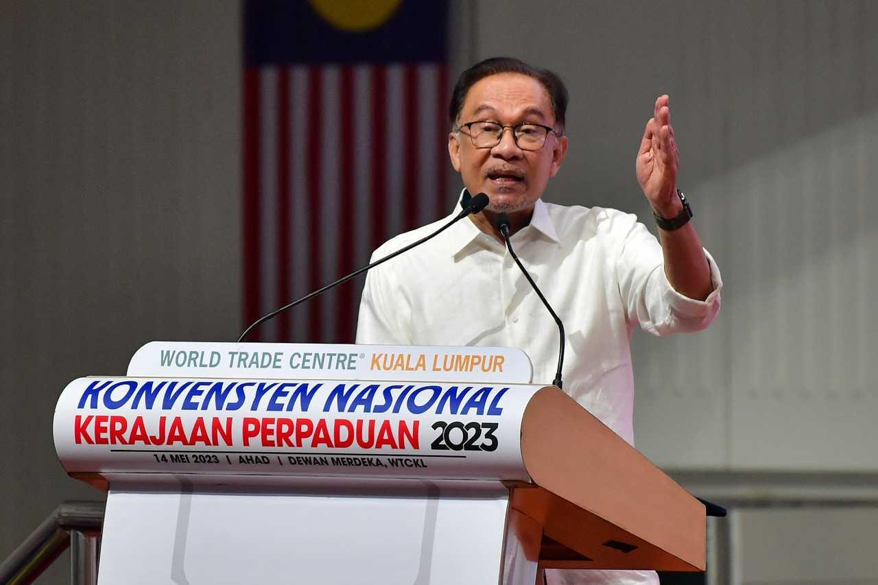 Prime Minister Anwar Ibrahim speaks at the unity government national convention at World Trade Center in Kuala Lumpur yesterday. Photo: Bernama