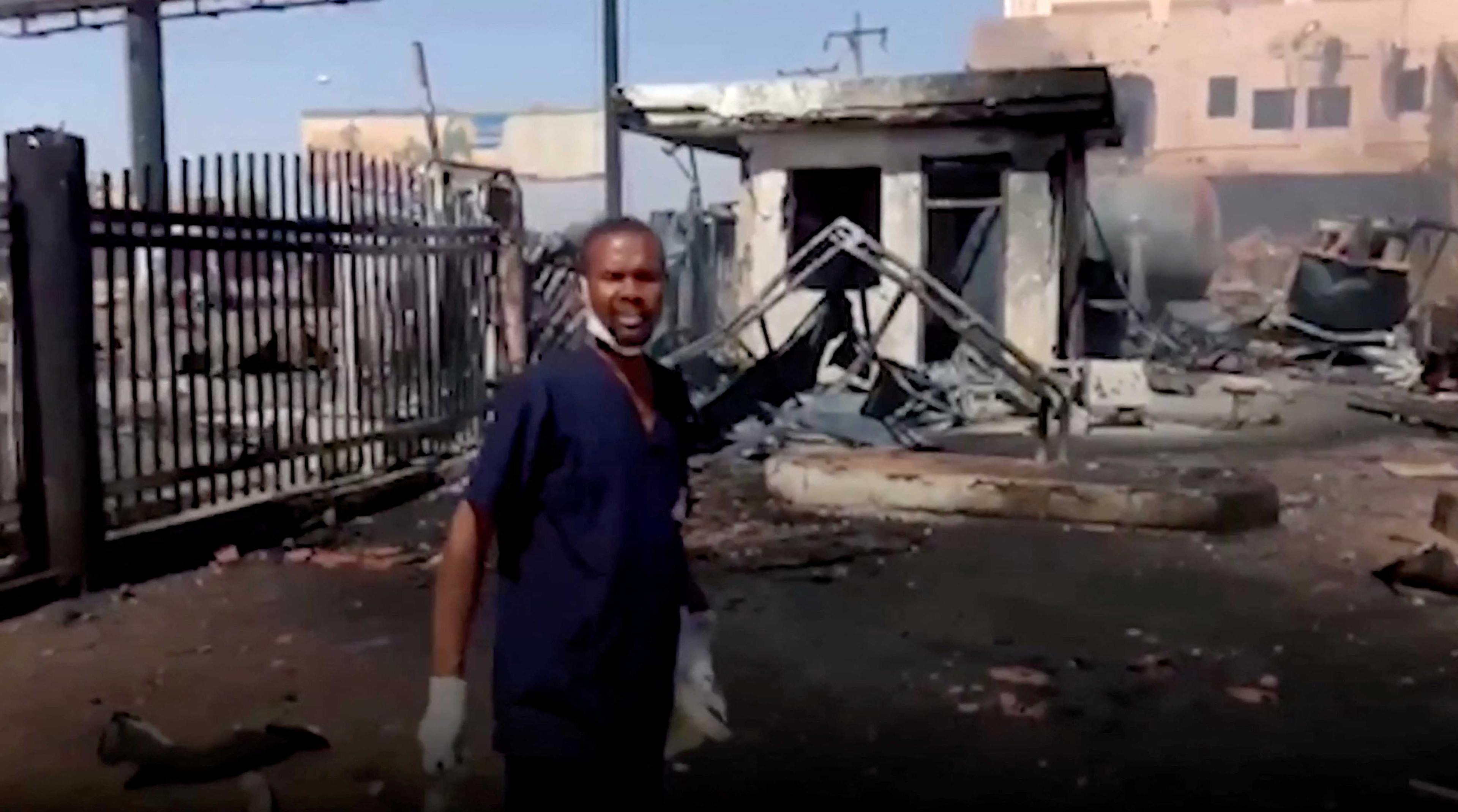 A doctor points at the damage outside the East Nile Hospital in Khartoum, Sudan, in this screen grab taken from a social media video released on May 15. Photo: Reuters