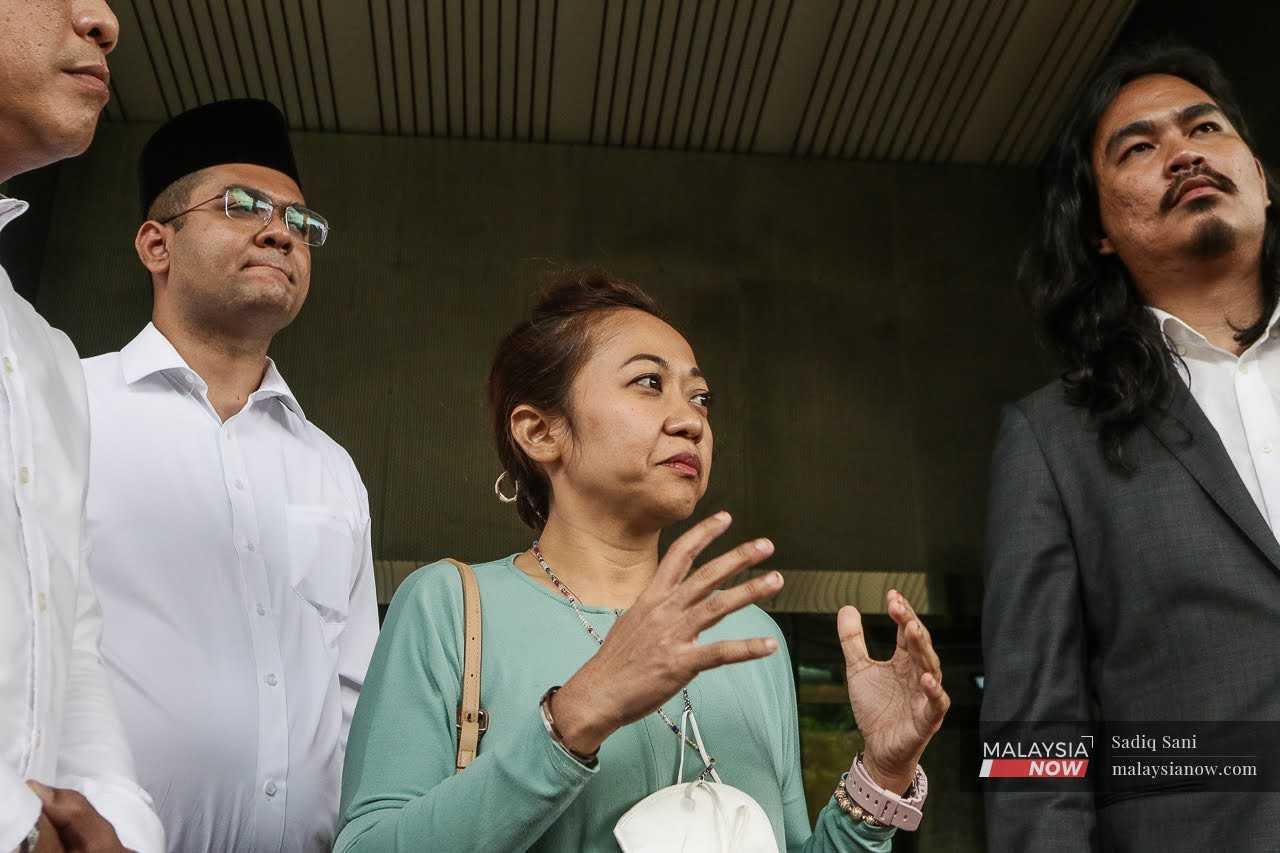 Halimah Nasoha, flanked by lawyer Zaid Malek, speaks to reporters outside the Malaysian Communications and Multimedia Commission headquarters in Cyberjaya, May 18.