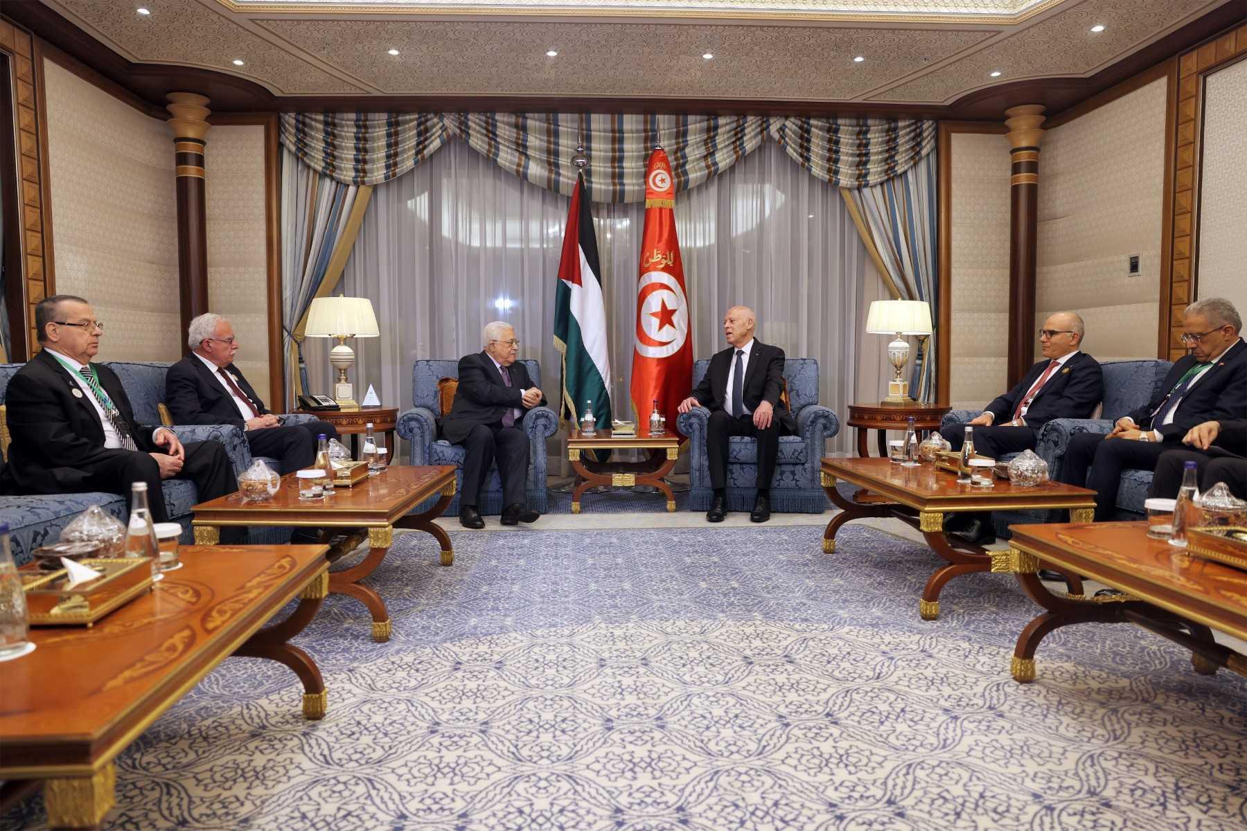 A handout picture provided by the Palestinian Authority's press office shows Palestinian president Mahmud Abbas meeting with Tunisia's President Kais Saied ahead of the 32nd Arab League Summit in Jeddah on May 18. Photo: AFP 