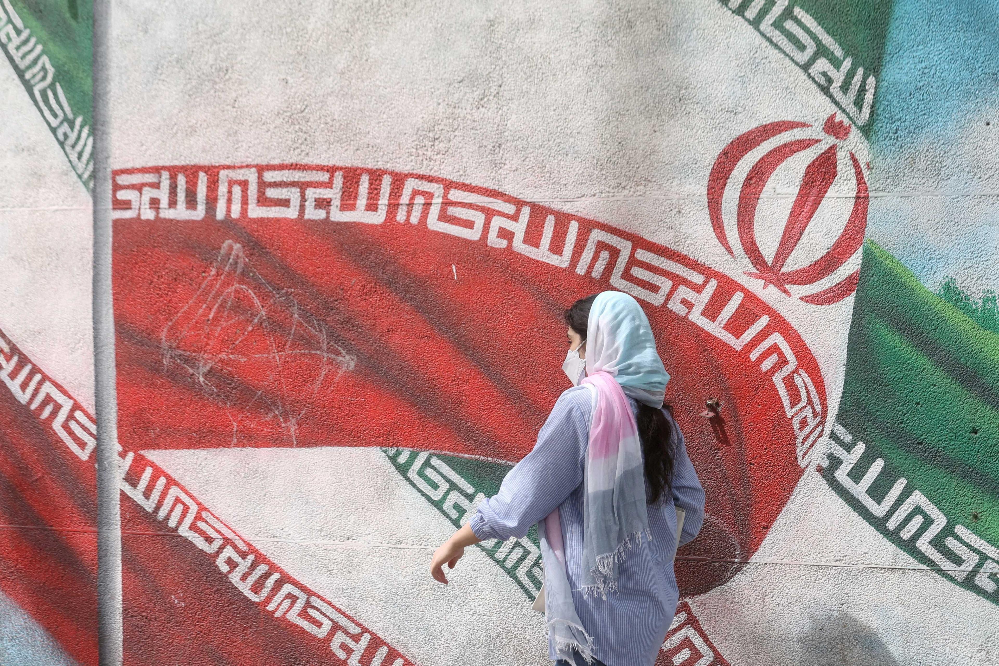 An Iranian woman walks in a street in Tehran, Iran, April 9. Photo: Reuters