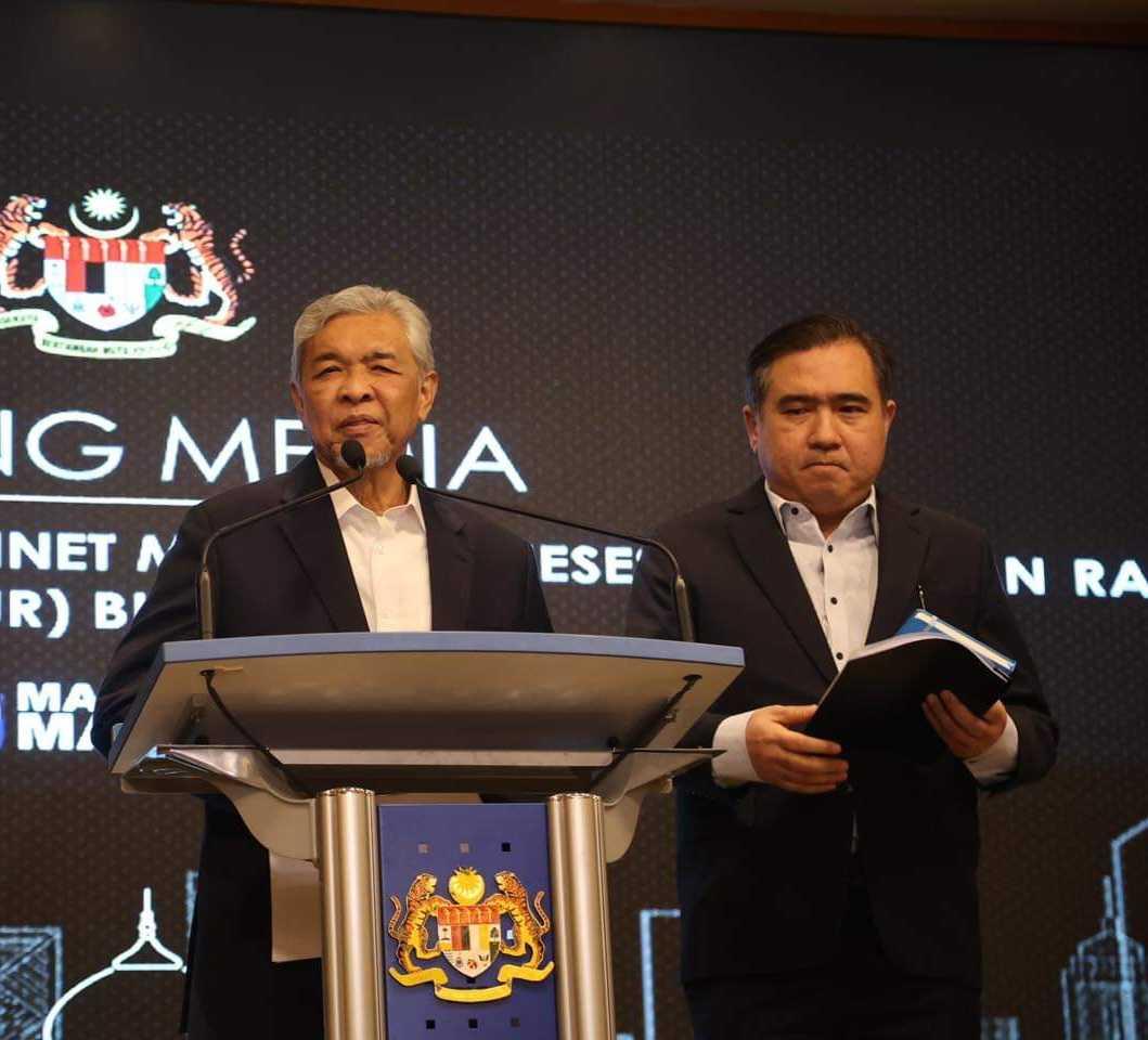 Barisan Nasional chairman Ahmad Zahid Hamidi (left) and DAP secretary-general Anthony Loke. Photo: Facebook
