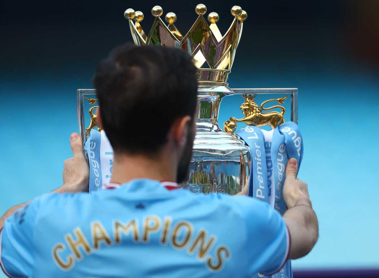 Manchester City's Bernardo Silva celebrates with the trophy after winning the Premier League at Etihad Stadium, Manchester, May 21. Photo: Reuters
