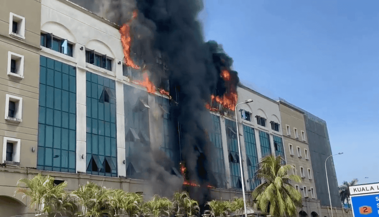 Smoke and flames are seen in a screenshot of a fire at the former Employees Provident Fund building in Petaling Jaya, taken from a video making the rounds on social media.