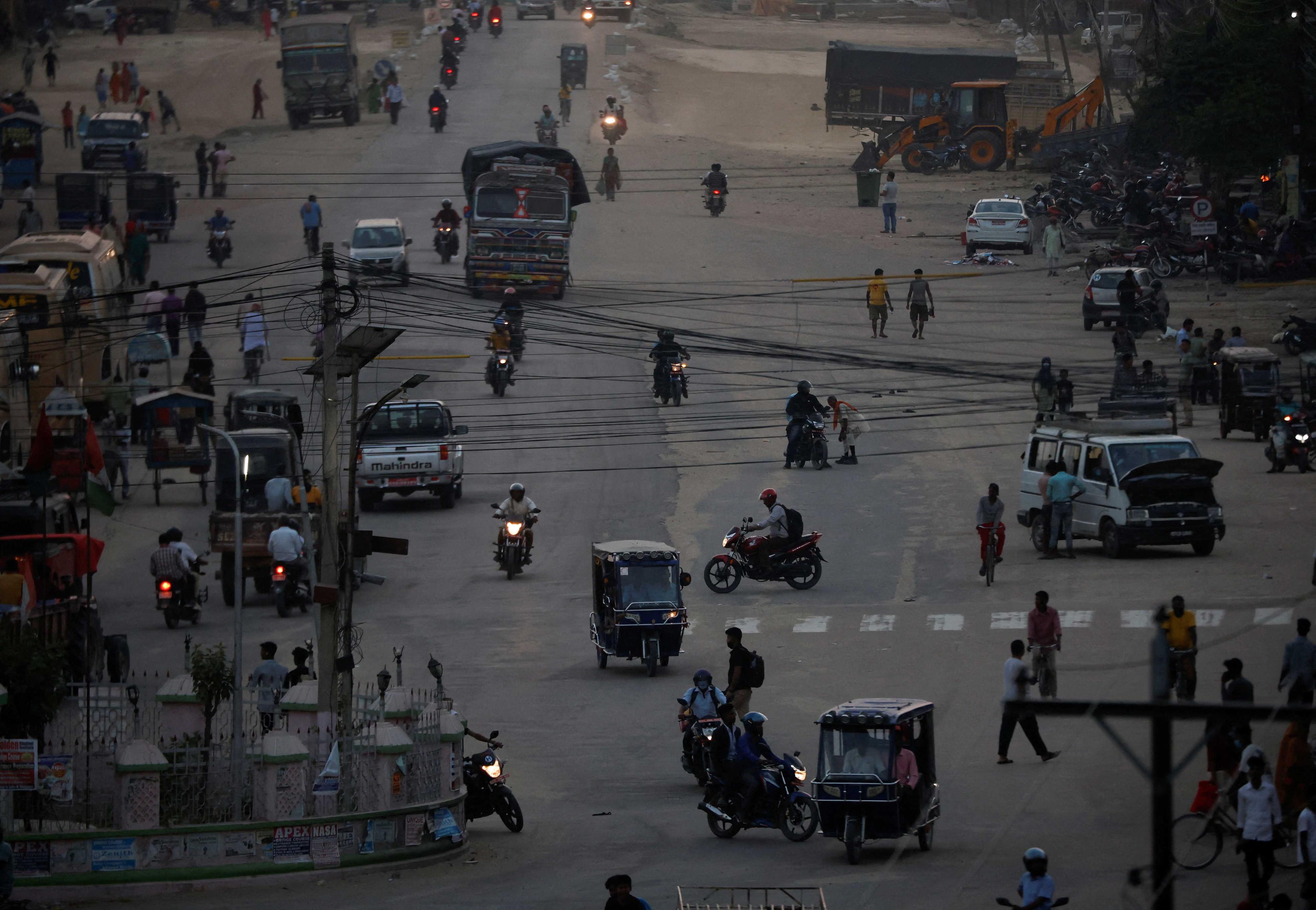 People commute at the Mahendra Highway also known as the East-West Highway passing through Lahan city at Siraha District in Madhesh Province southeastern Nepal May 9. Photo: Reuters