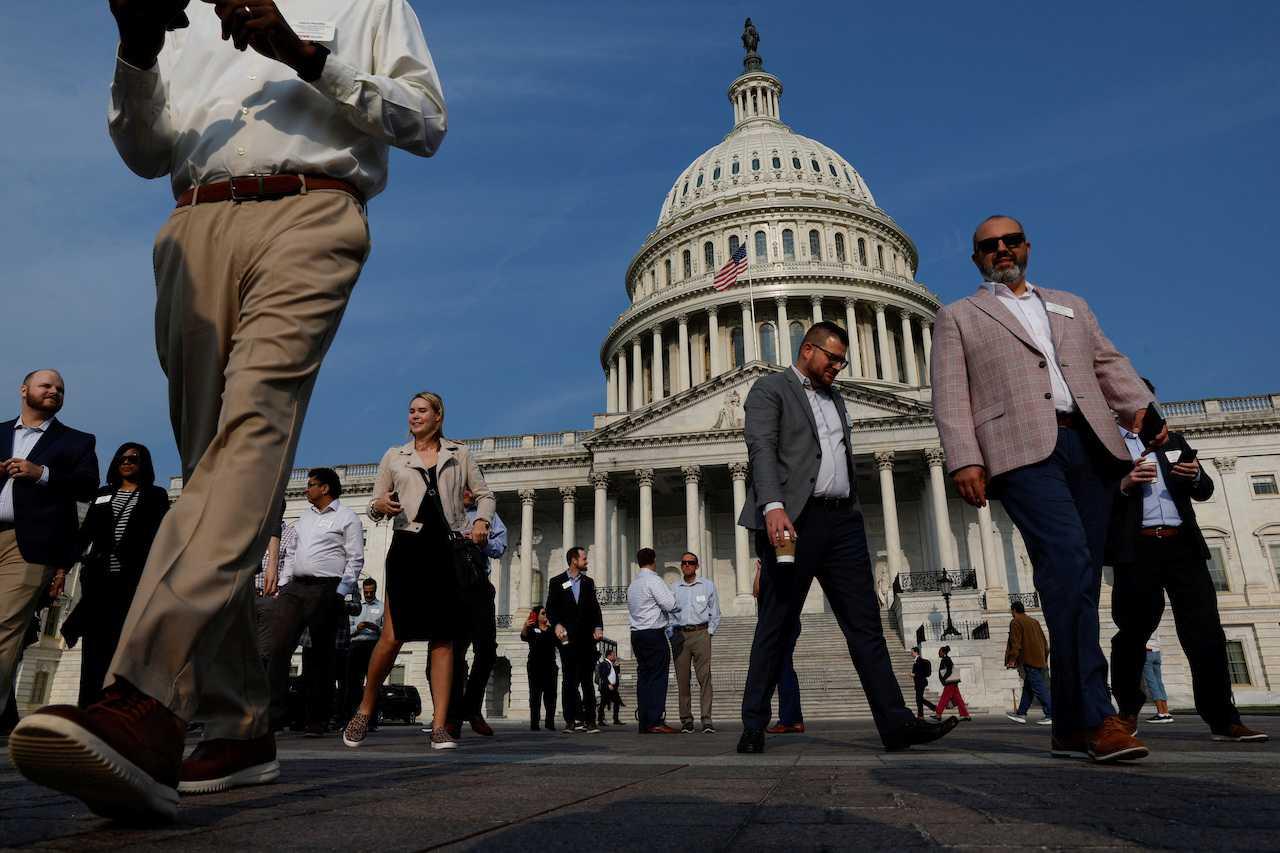 Visitors walk on the plaza at the US Capitol in the midst of ongoing negotiations seeking a deal to raise the US' debt ceiling, in Washington, May 24. Photo: Reuters