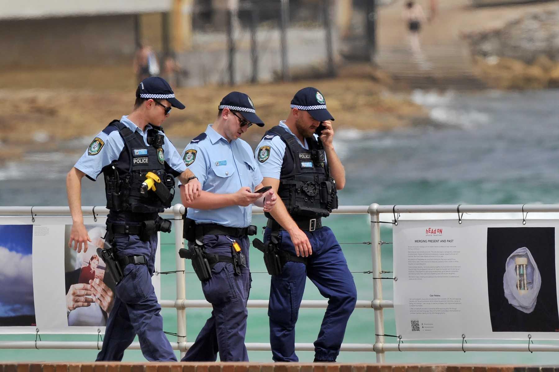 Police officers patrol on the Bondi Beach in Sydney, Australia, on Dec 22, 2021. Photo: AFP