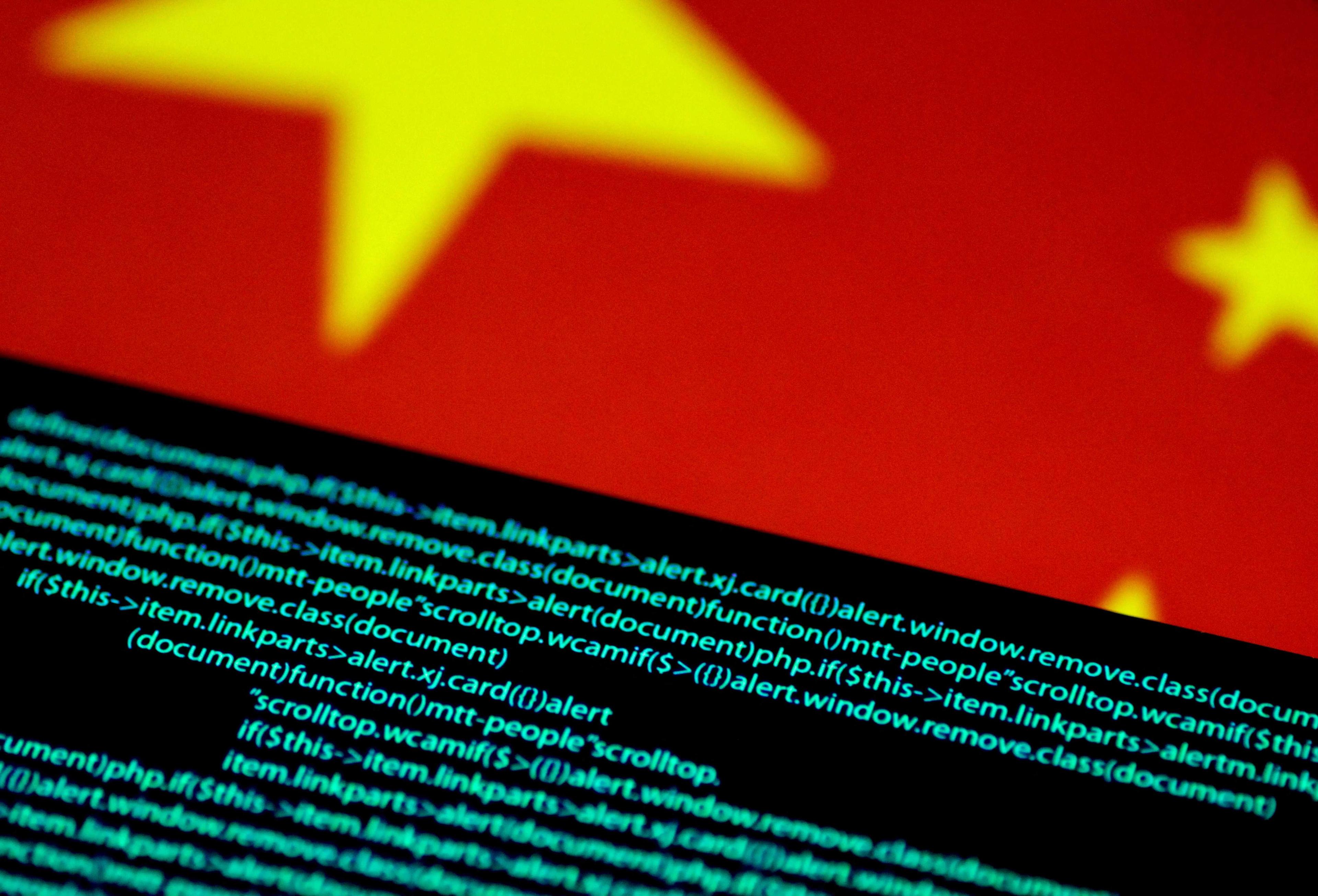 Computer code is seen on a screen above a Chinese flag in this July 12, 2017 illustration photo. Photo: Reuters
