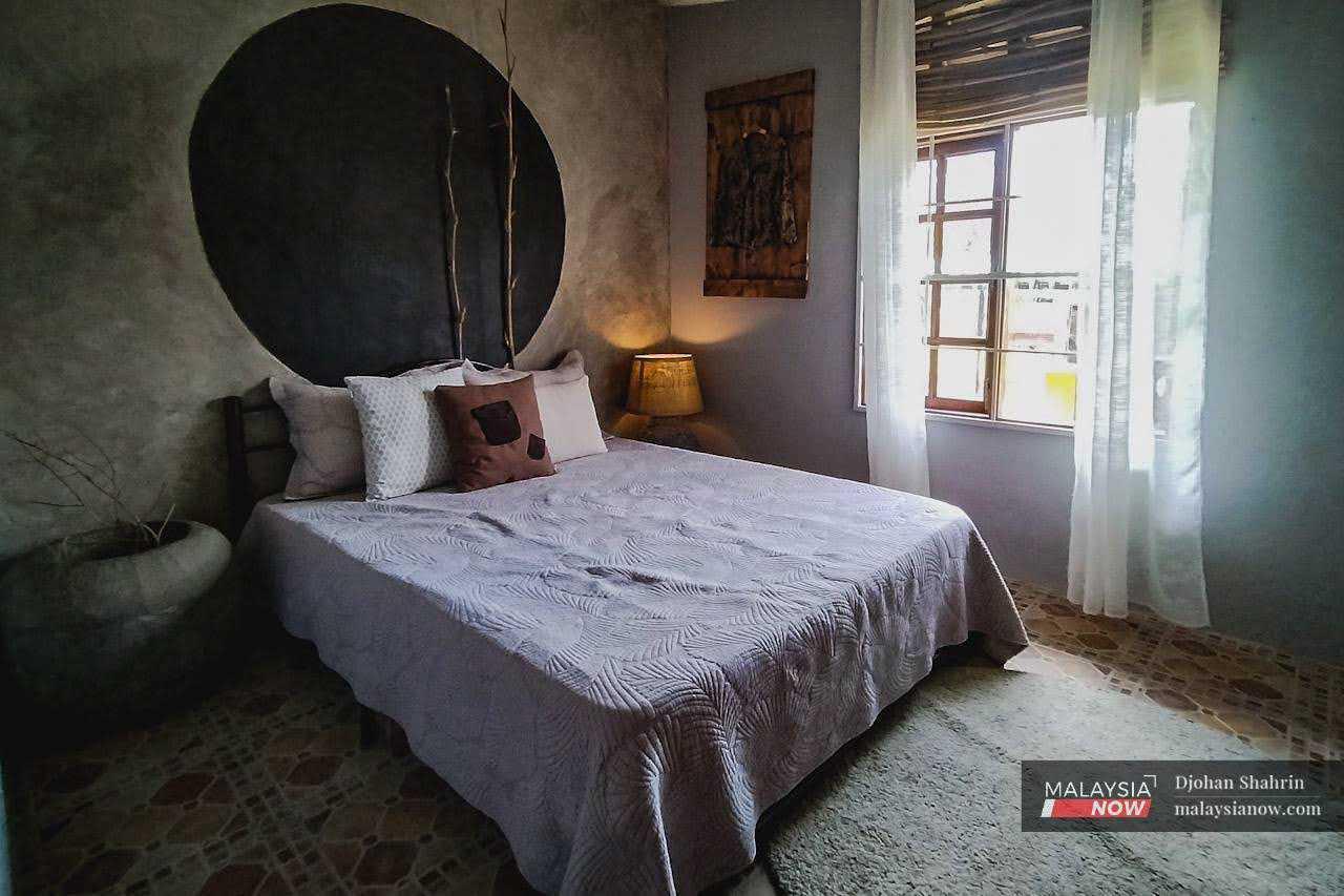 The guest room, where visitors to the unusual home rest and enjoy the village surroundings. 