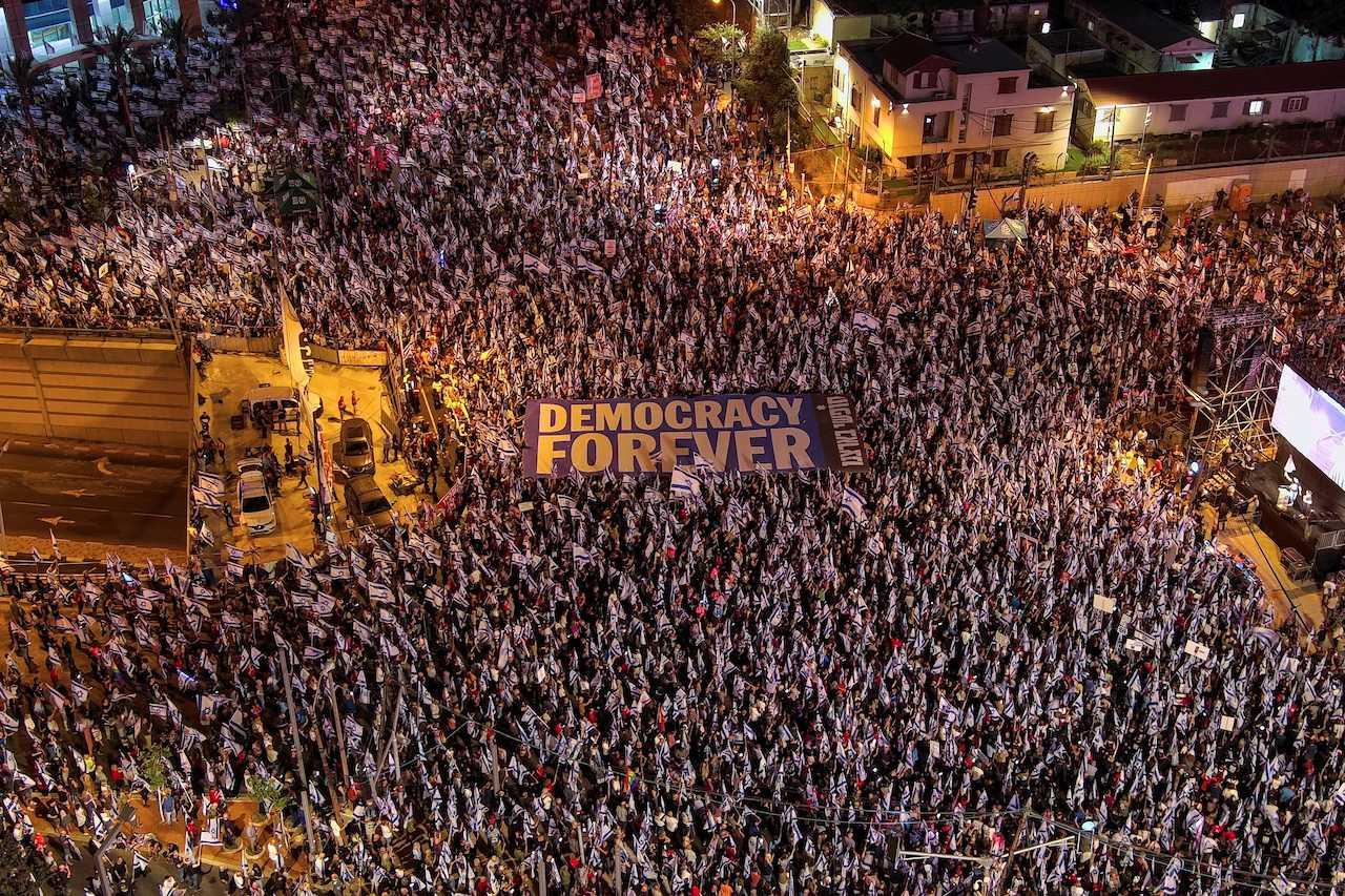 An aerial view shows protesters holding a sign with the words 'Democracy Forever' as they attend a demonstration against Prime Minister Benjamin Netanyahu and his nationalist coalition government's judicial overhaul, in Tel Aviv, Israel, May 27. Photo: Reuters