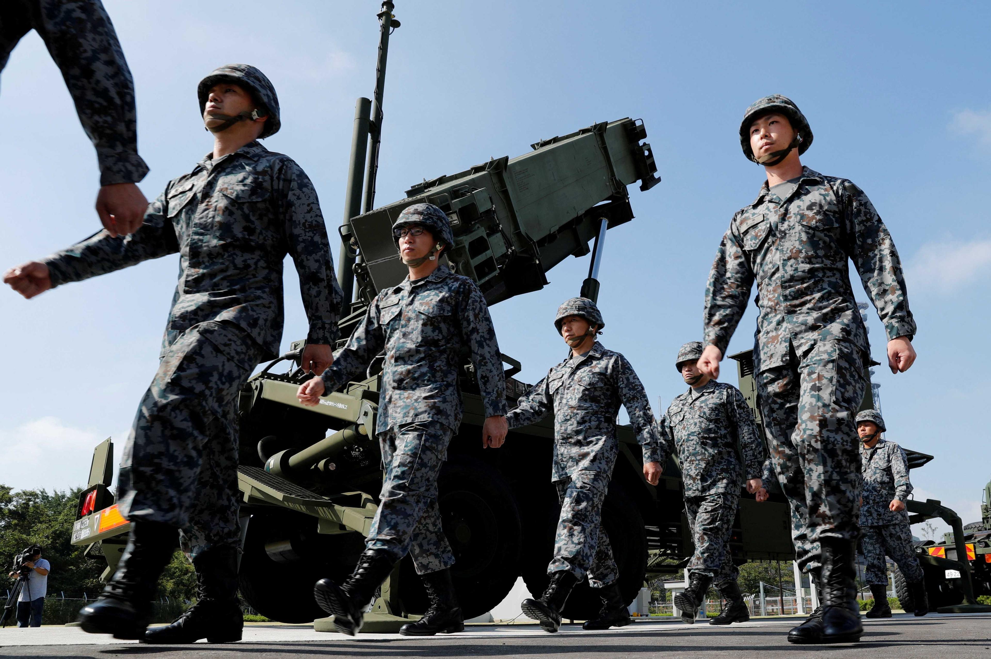 Japan Self-Defense Forces soldiers walk past a Patriot Advanced Capability-3 (Pac-3) missile unit in Tokyo, Japan, Oct 8, 2017. Photo: Reuters